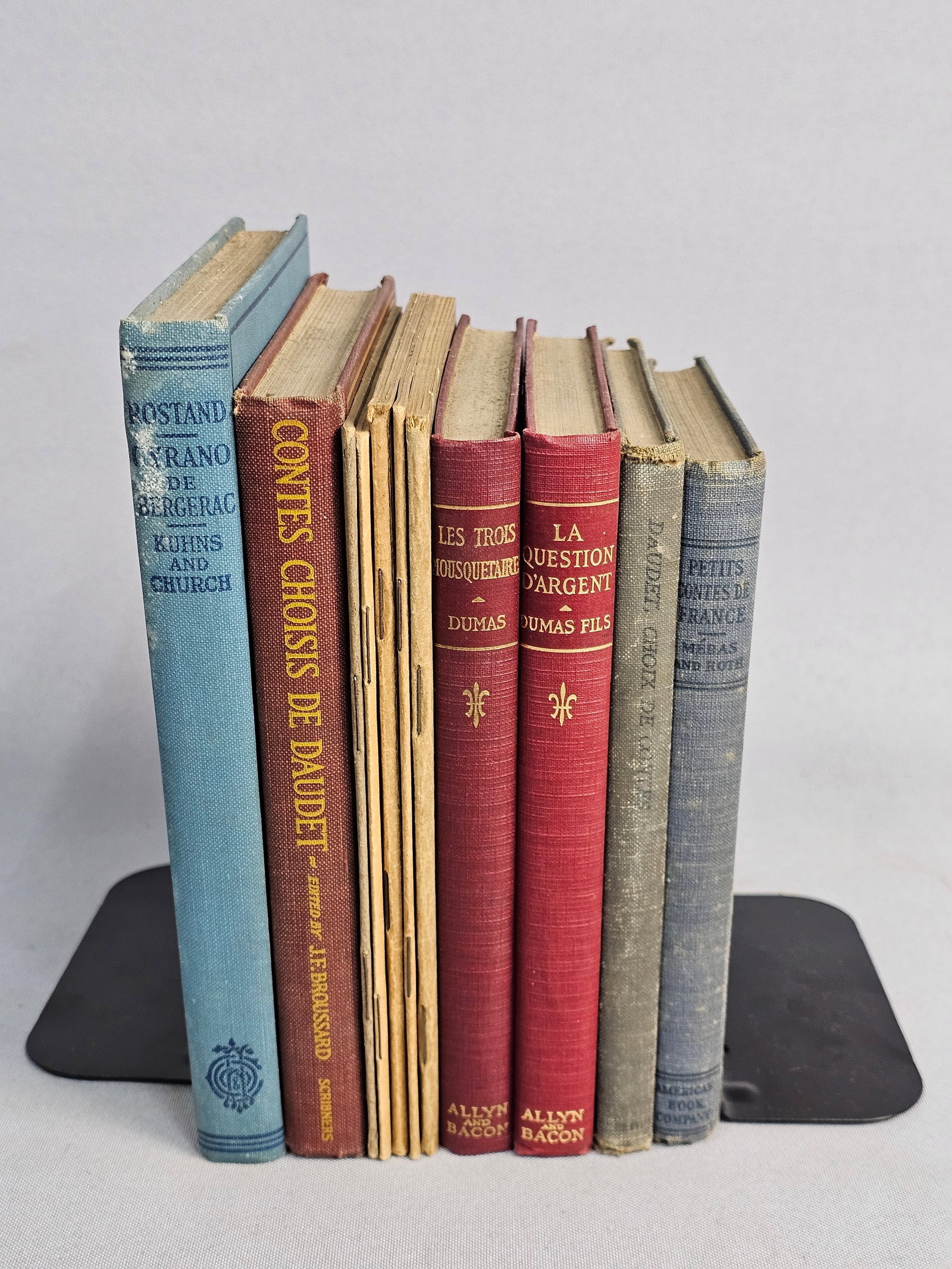 Eleven Vintage French Academic Literature Books: This collection of eleven antique and vintage French literature volumes and educational pamphlets includes works by authors such as Alexandre Dumas, Moliere, and Edmond Rostand. Les Trois