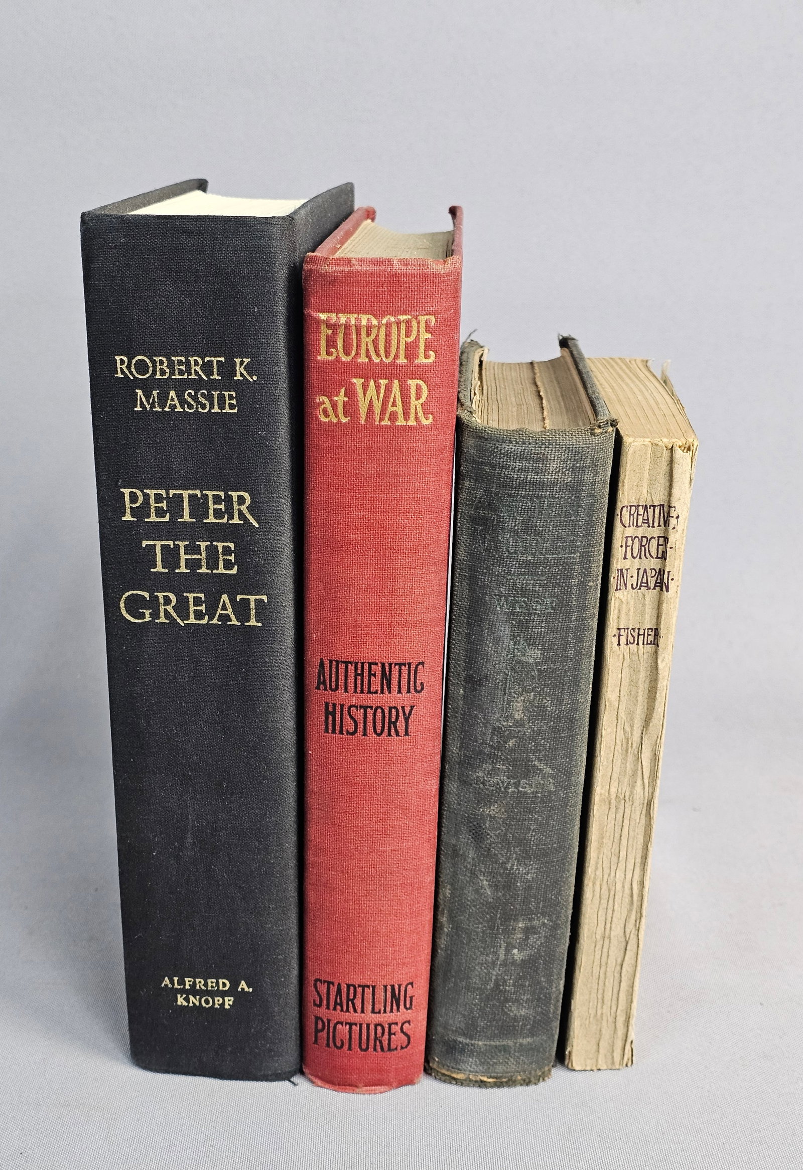 A Collection of Four Historical Books: This group of historical works features Robert K. Massie's 1980 biography of Peter the Great and a 1914 pictorial history titled Europe at War by Judge Henry Neil. Willis Mason West's 1913 edition of