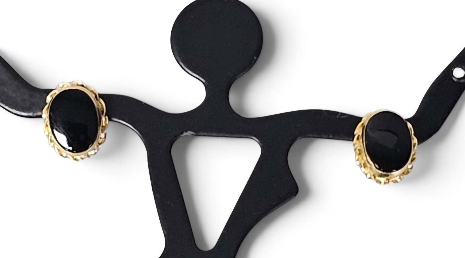14K Gold Black Onyx Earrings: These stud earrings are crafted in 14 karat yellow gold, each featuring an oval cabochon-cut black onyx gemstone. The stones are secured in decorative scalloped bezel settings and utilize standard pos