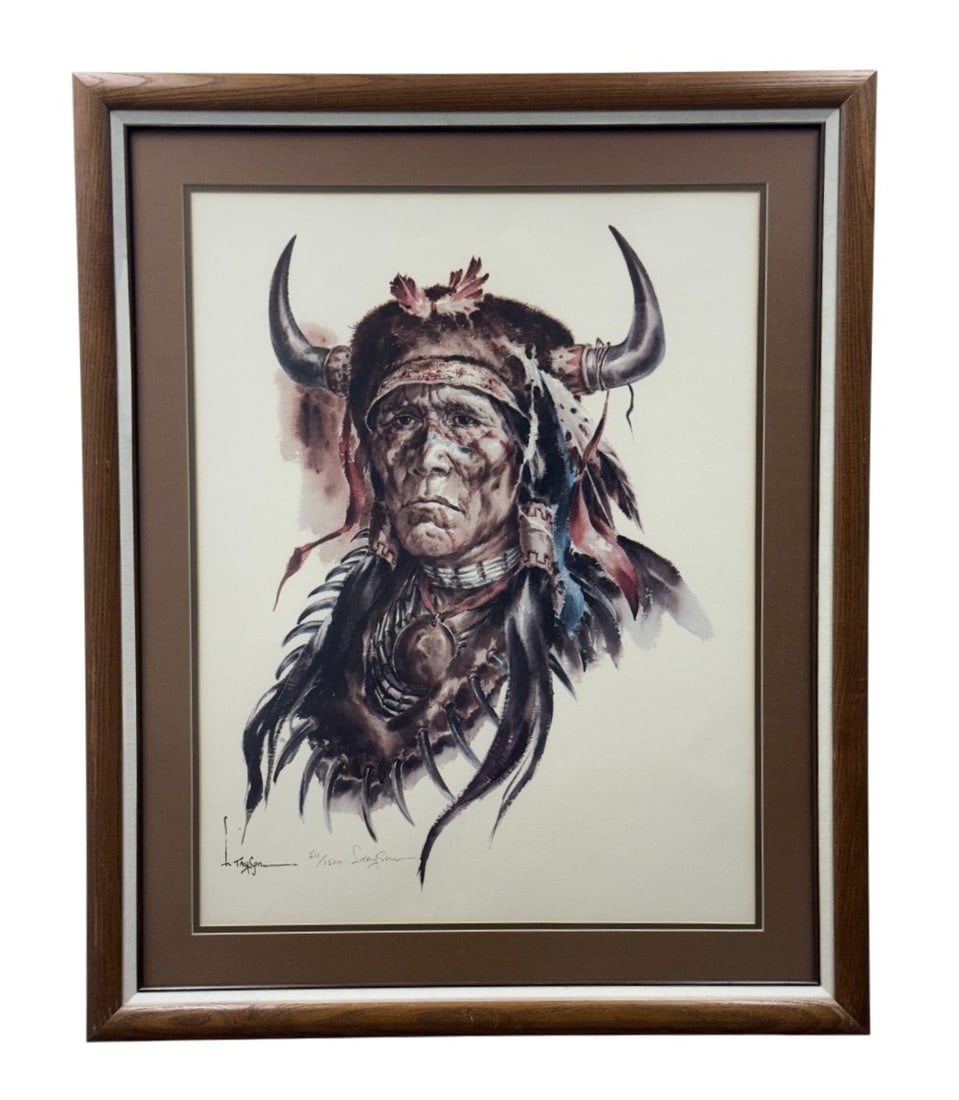 Lyle Tayson Signed Native American Lithograph: A limited-edition offset lithograph by Lyle Tayson depicting a realist portrait of a Native American warrior wearing a ceremonial bison headdress. The artwork is hand-signed in pencil at the lower rig