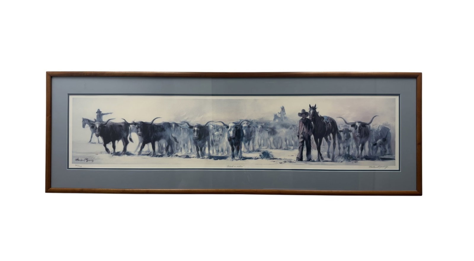 Harland Young Tired a ridin Lithograph: Harland Young panoramic Western limited edition offset lithograph on paper titled Tired a ridin. The scene features a cowboy and horse among a longhorn cattle herd, hand-signed in pencil and numbered