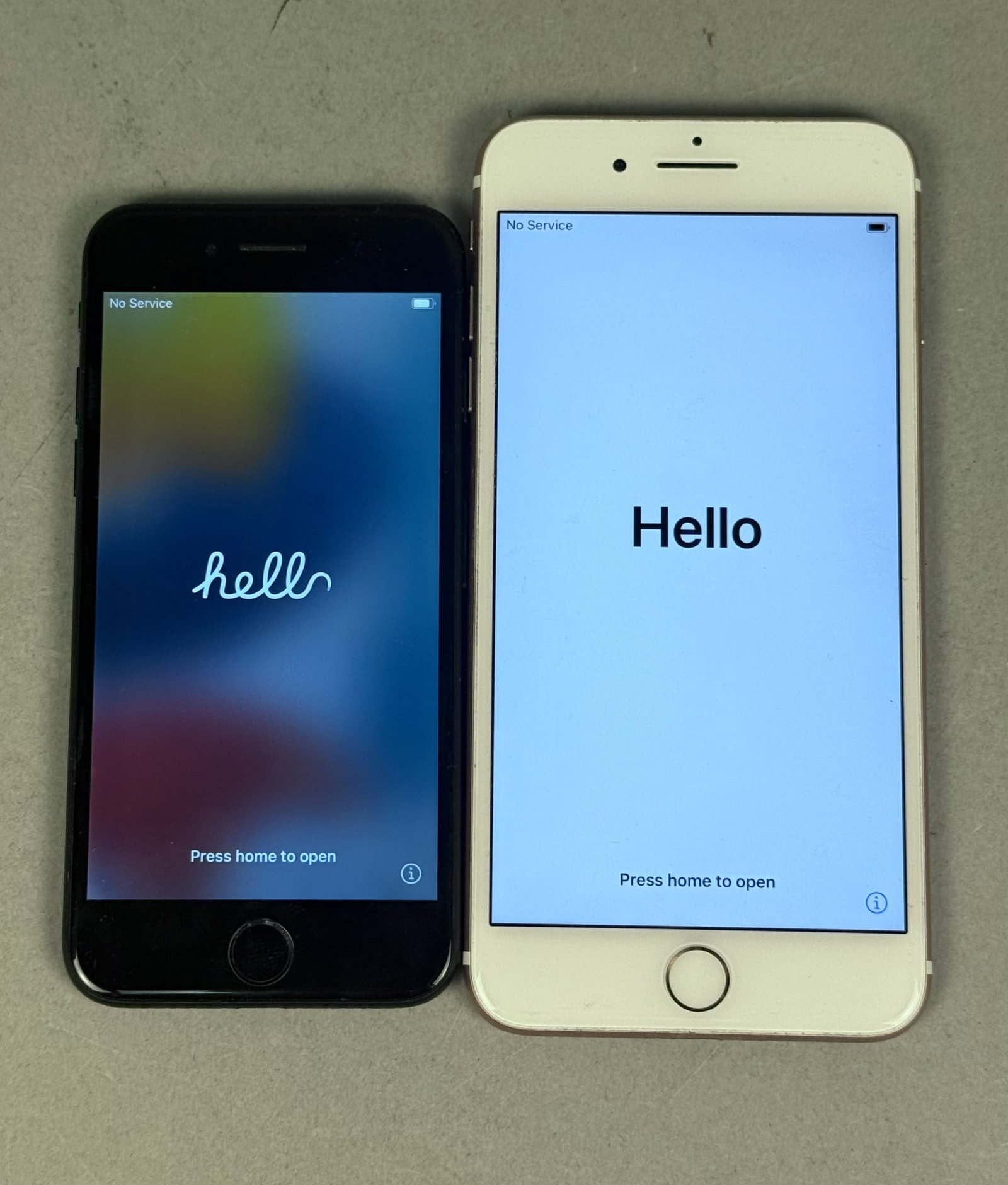 Two Apple iPhone 7 Smartphones: This lot features two Apple smartphones including a matte black iPhone 7 Model A1660 and a rose gold iPhone 7 Plus Model A1661. Both units display standard manufacturer markings on the rear casing.