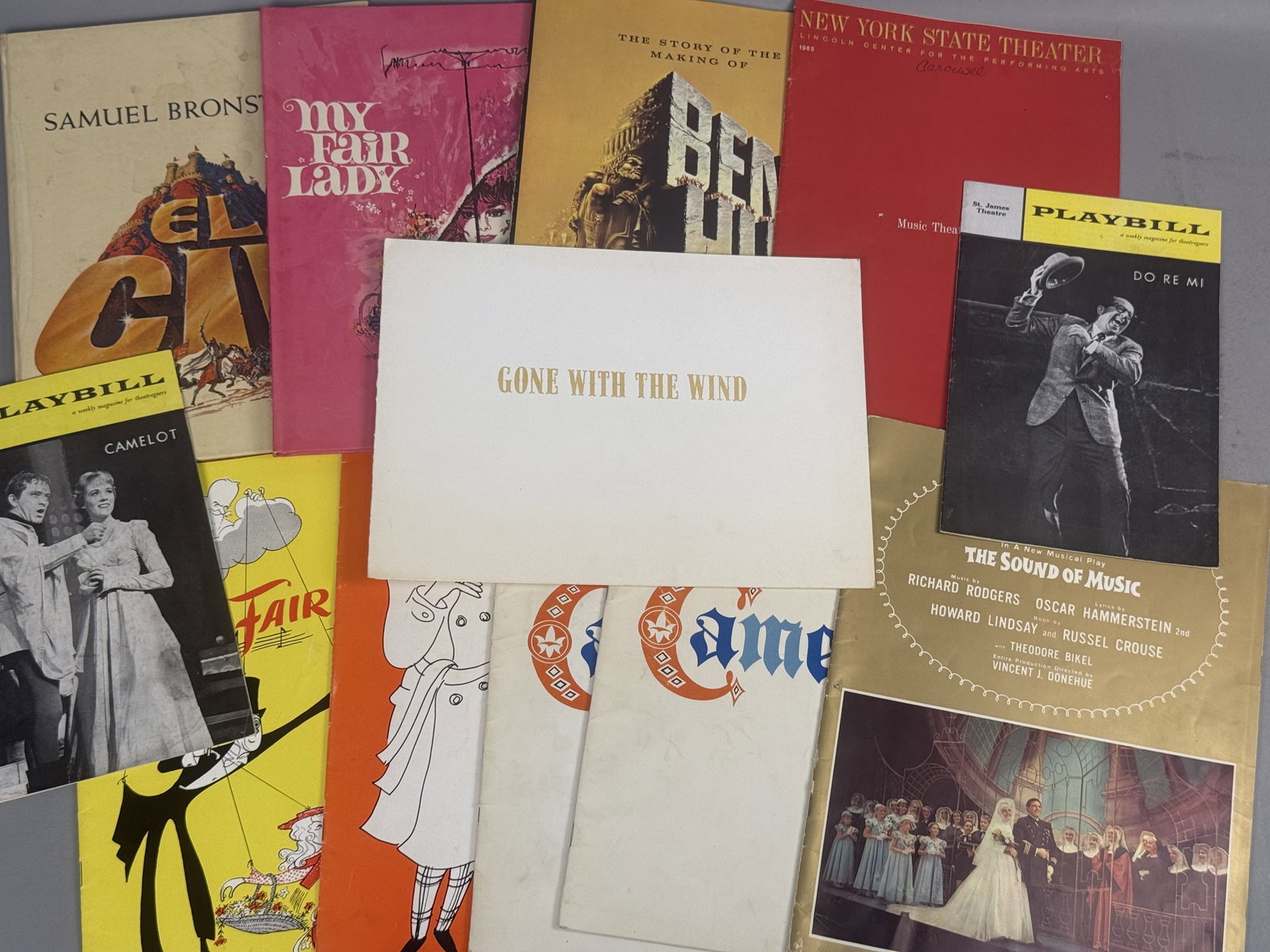 Vintage Broadway and Film Program & Book Collection: This assortment includes thirteen pieces of mid-century theatrical and film ephemera dating between 1959 and 1965. Featured items include original cast playbills for Camelot and Do Re Mi, plus