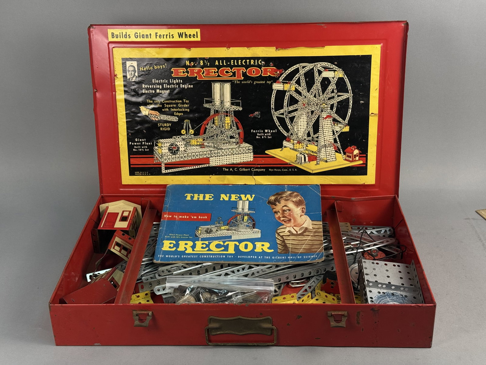Gilbert No. 8 1/2 All-Electric Erector Set: This A.C. Gilbert Company No. 8 1/2 All-Electric Erector set features various plated and painted steel components including square girders, base plates, and gears. The set includes a reversing