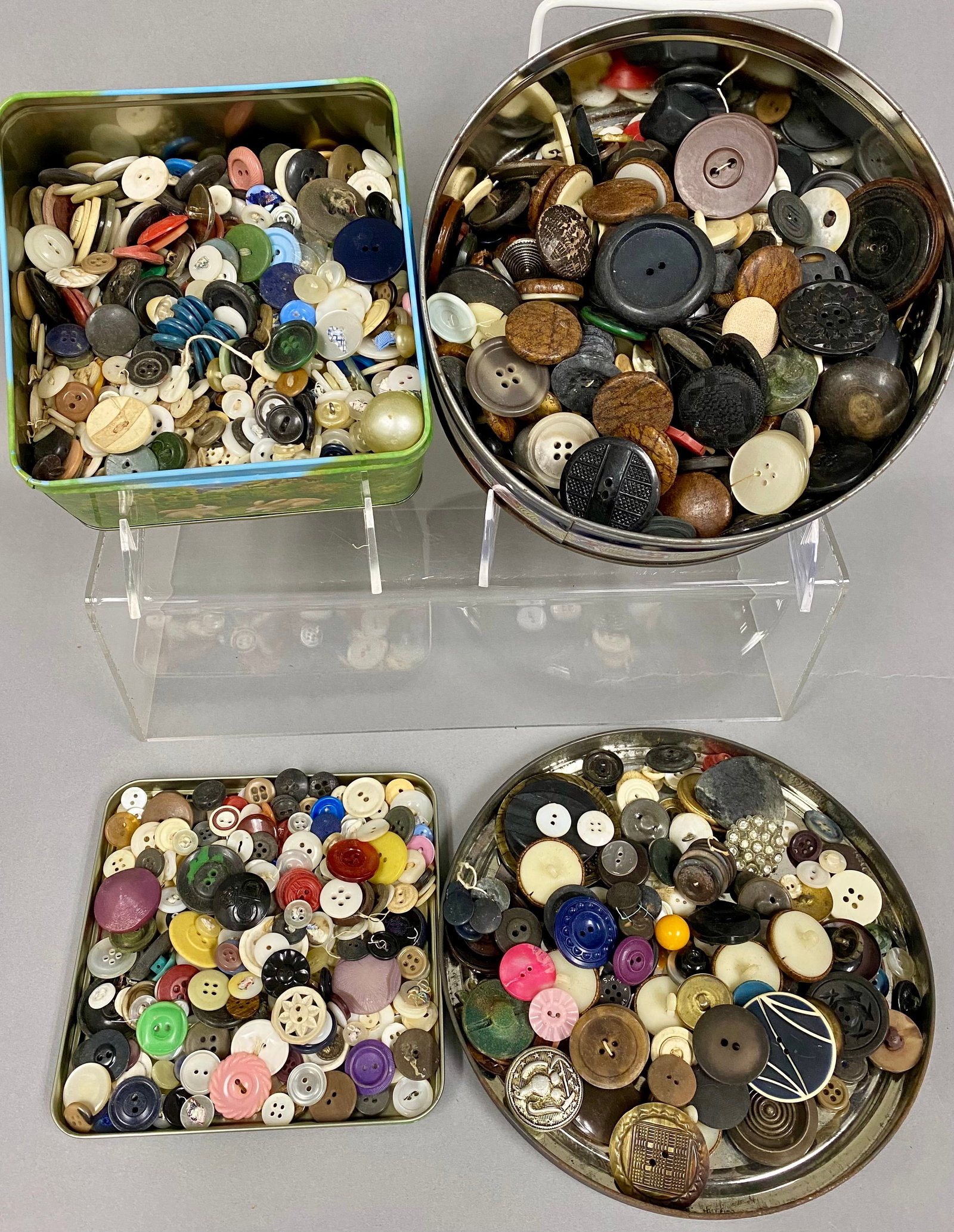 Collection of Assorted Vintage Mixed Buttons: This lot contains an extensive assortment of buttons in diverse materials including mother-of-pearl, faceted glass, carved wood, molded plastics, and decorative metals. The pieces range from utilitari