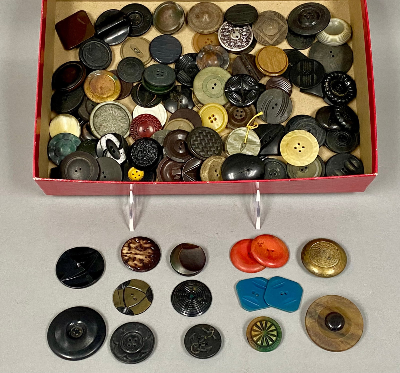 Vintage and Antique Button Collection: An extensive assortment of vintage and antique buttons featuring various materials such as early plastics, wood, and metal with geometric and novelty designs. The group includes two-hole, four-hole, a
