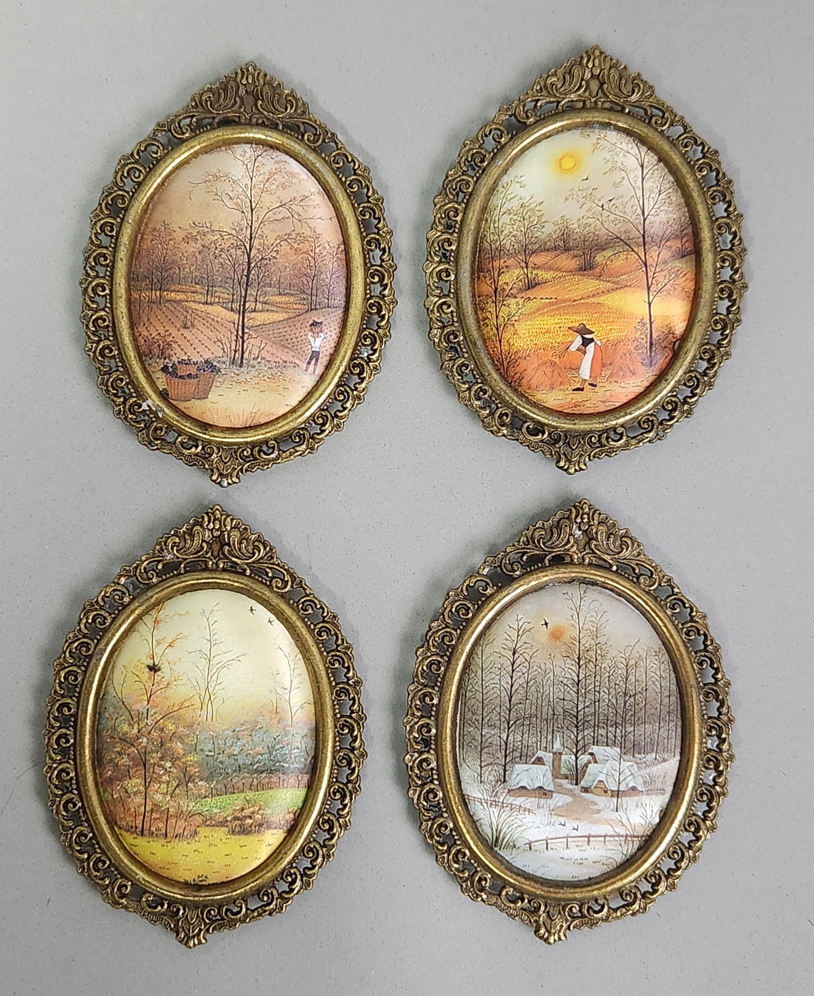 Italian School The Seasons: This suite consists of landscape miniatures depicting the cycles of the seasons printed on a textured fabric support. The collection remains in good condition with minor age-appropriate wear. Light