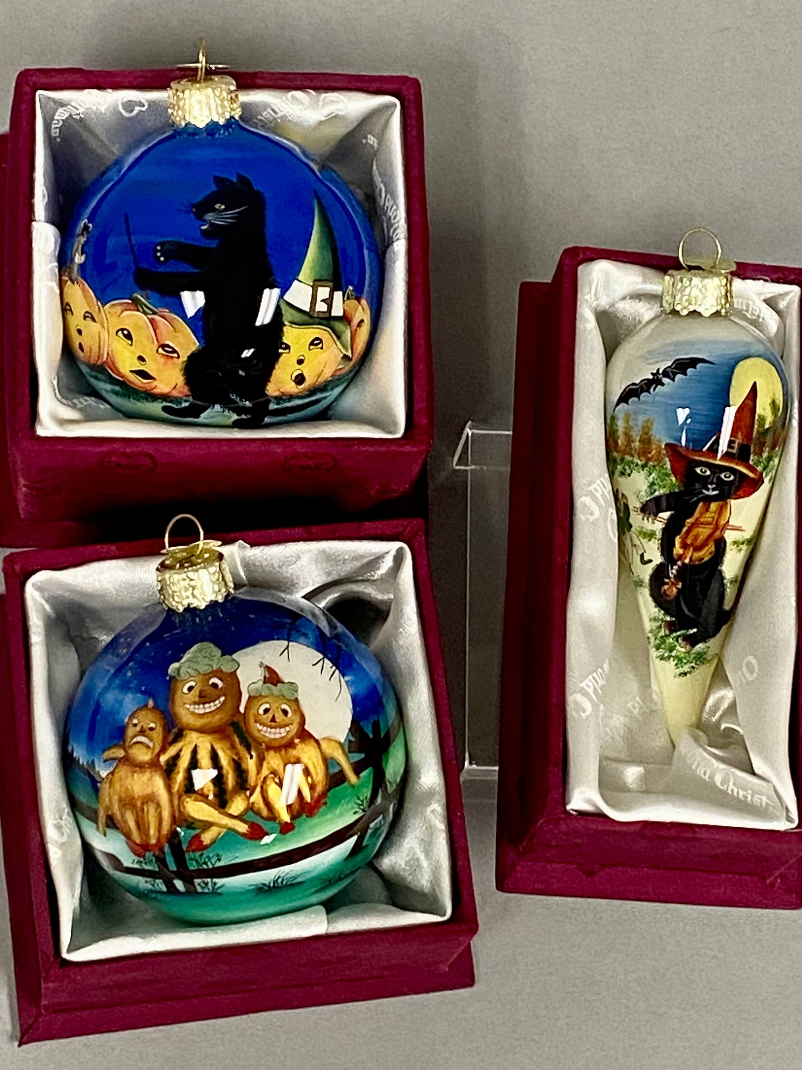 Three Old World Christmas Halloween Ornaments: This collection of three Old World Christmas glass ornaments features intricate hand-painted scenes executed with the Li Bien interior-painting technique. The set includes the By the Light of the Moon