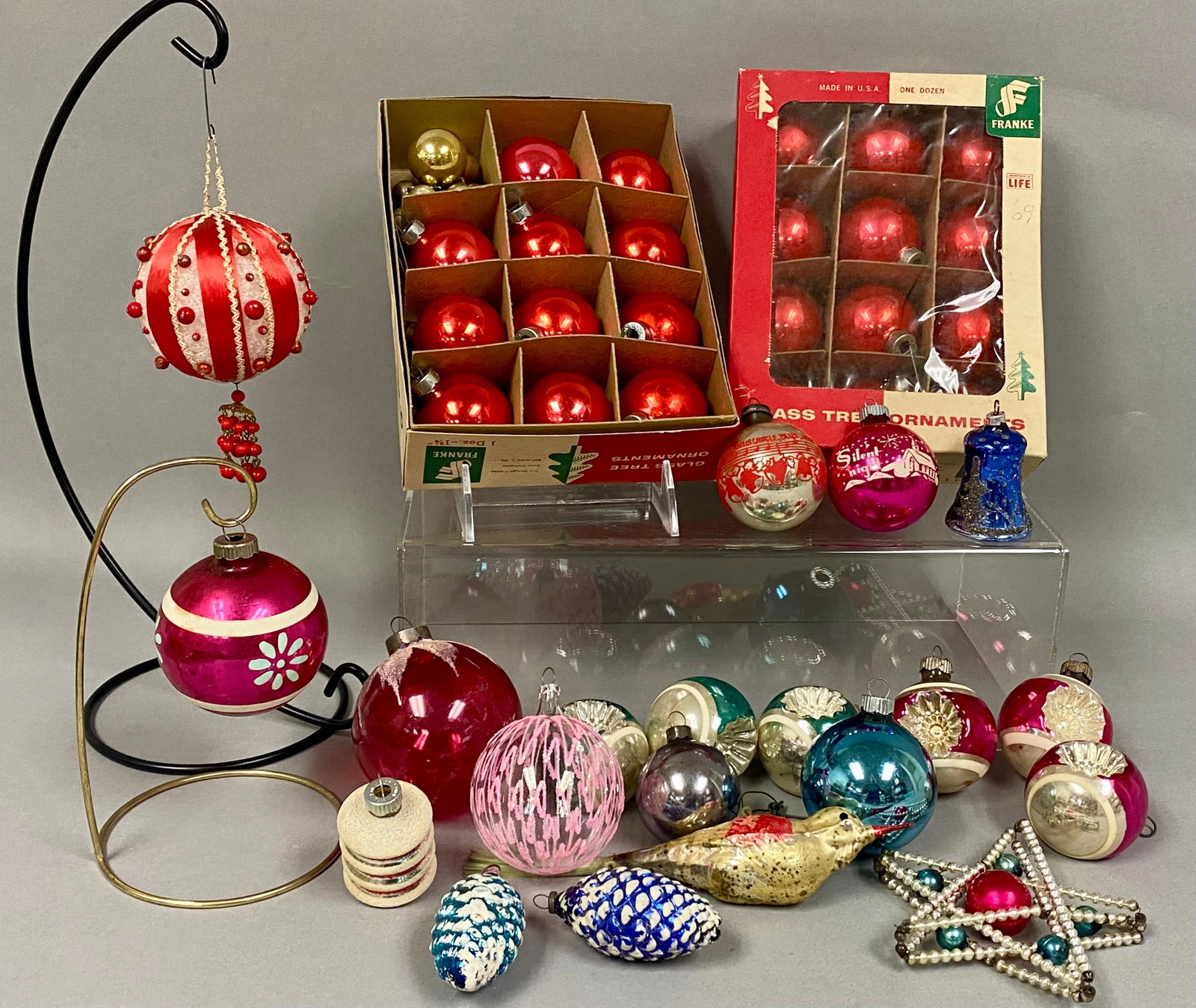 Collection of Vintage Glass Christmas Ornaments: This collection of 50 mid-century glass ornaments features a variety including a boxed set of red spheres by George Franke Sons Company and multiple pieces marked Shiny Brite. The grouping contains di