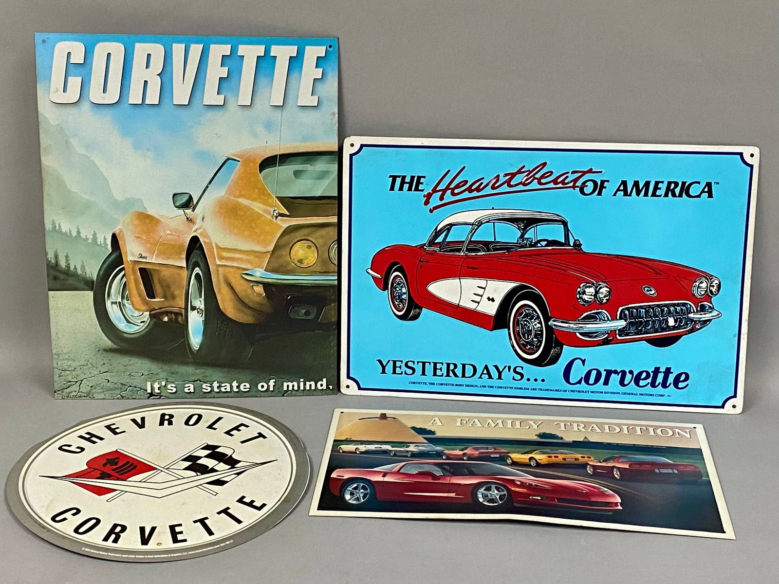 Licensed Chevrolet Corvette Metal Signs: This collection includes four officially licensed General Motors metal signs manufactured by Desperate Enterprises, Inc. and Kool Collectibles & Graphics, LLC. The lot features various Corvette