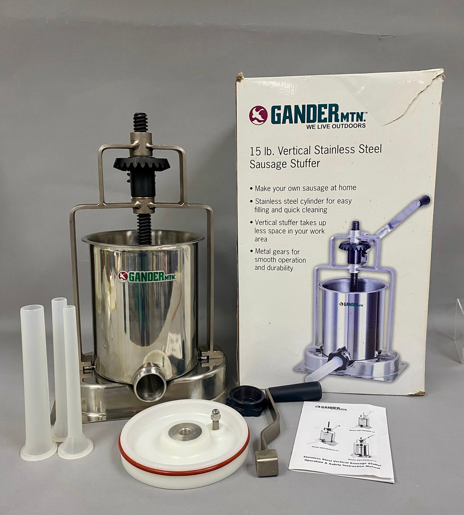 Gander Mountain 15lb Sausage Stuffer: This Gander Mountain 15 lb. capacity vertical sausage stuffer features a brushed stainless steel cylinder and heavy-duty metal gears for manual operation. The unit, model ST-604015-13, is complete