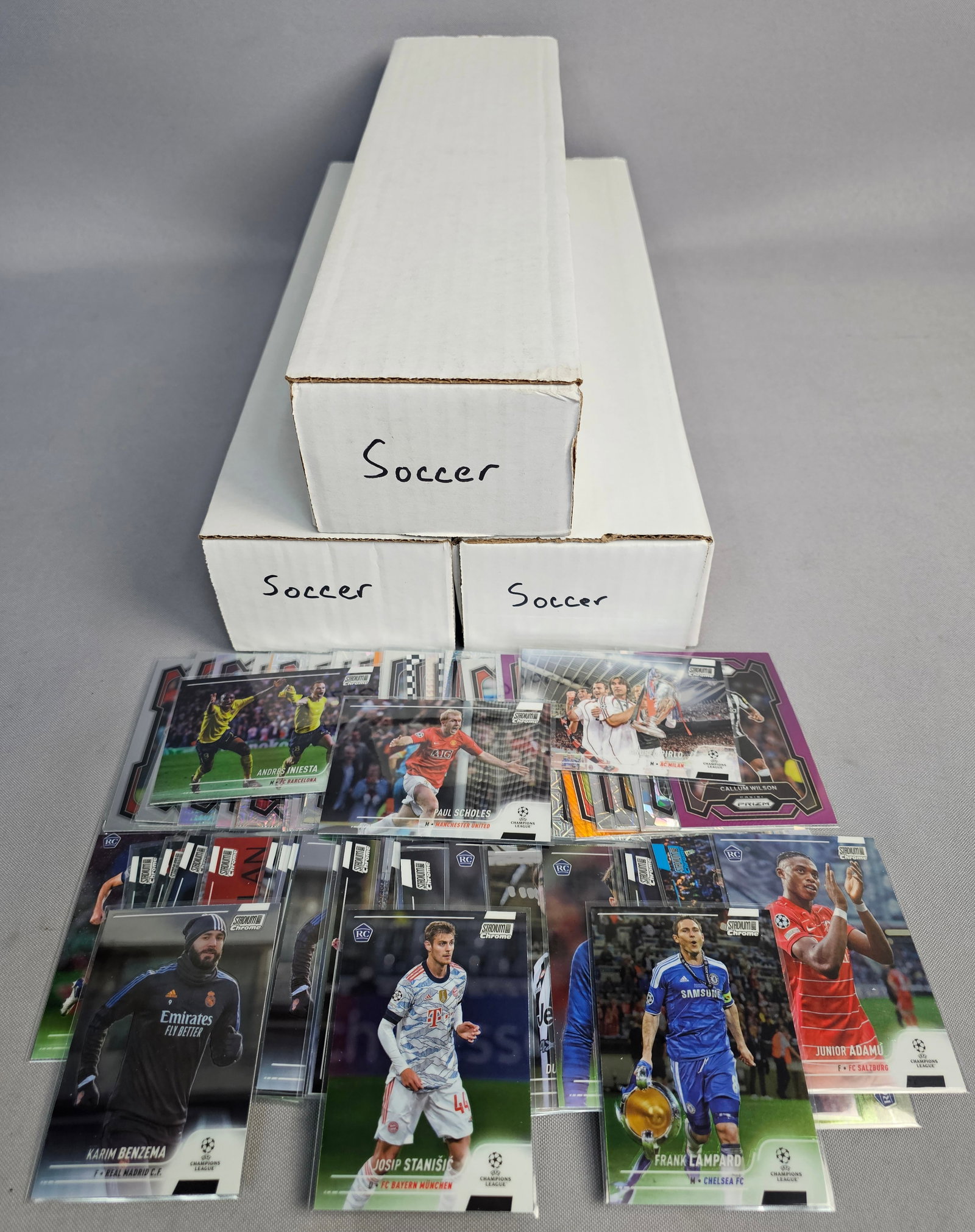 Collection of Modern Soccer Cards: An assortment of modern soccer trading cards featuring releases from Panini and Topps including Prizm Premier League and Stadium Club Chrome sets. The collection highlights veteran stars, retired