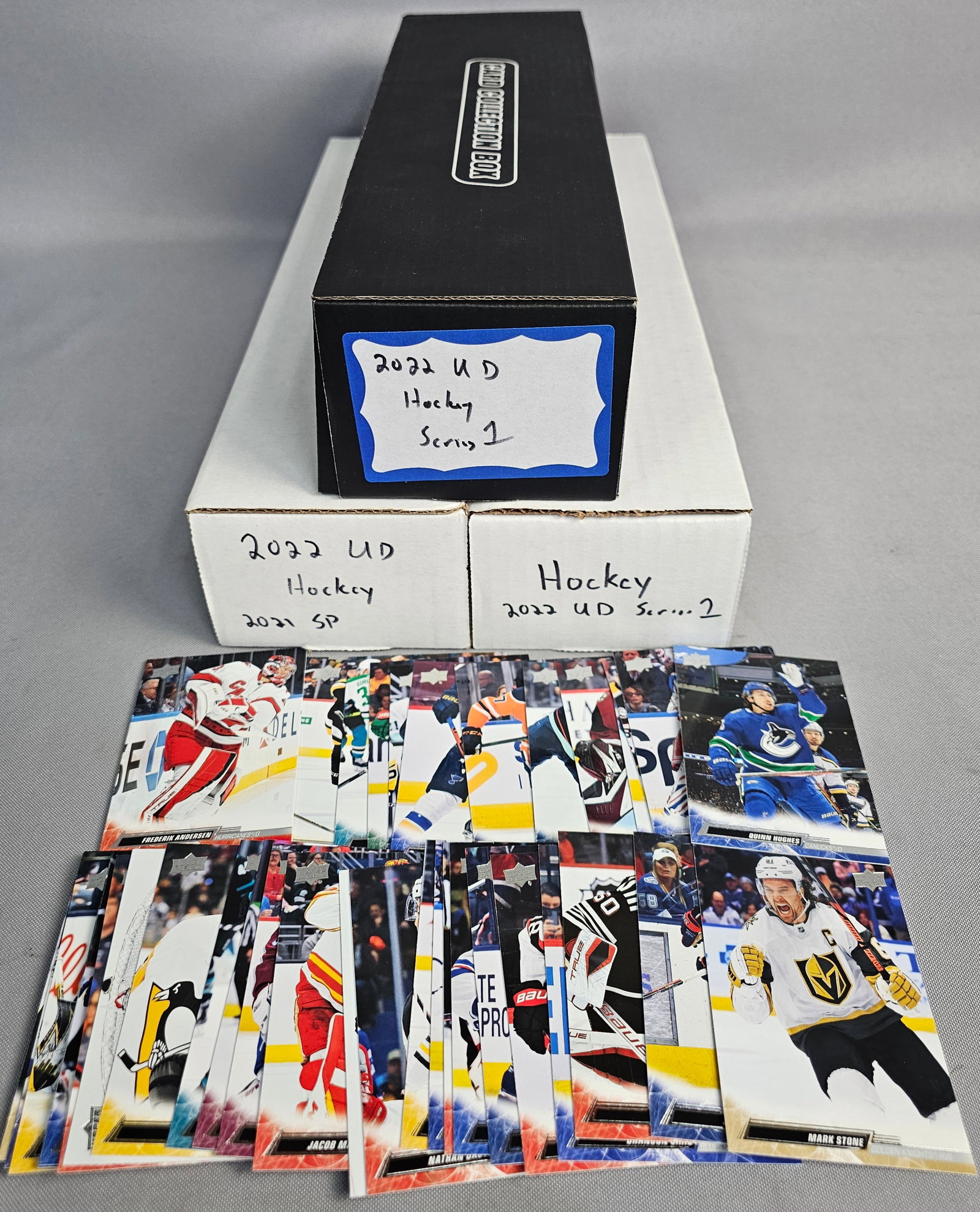 Upper Deck NHL Hockey Card Collection: This collection features Upper Deck NHL hockey trading cards from the 2021-2022 and 2022-2023 seasons, housed in three storage boxes. The assortment includes Series 1, Series 2, and SP Authentic sets