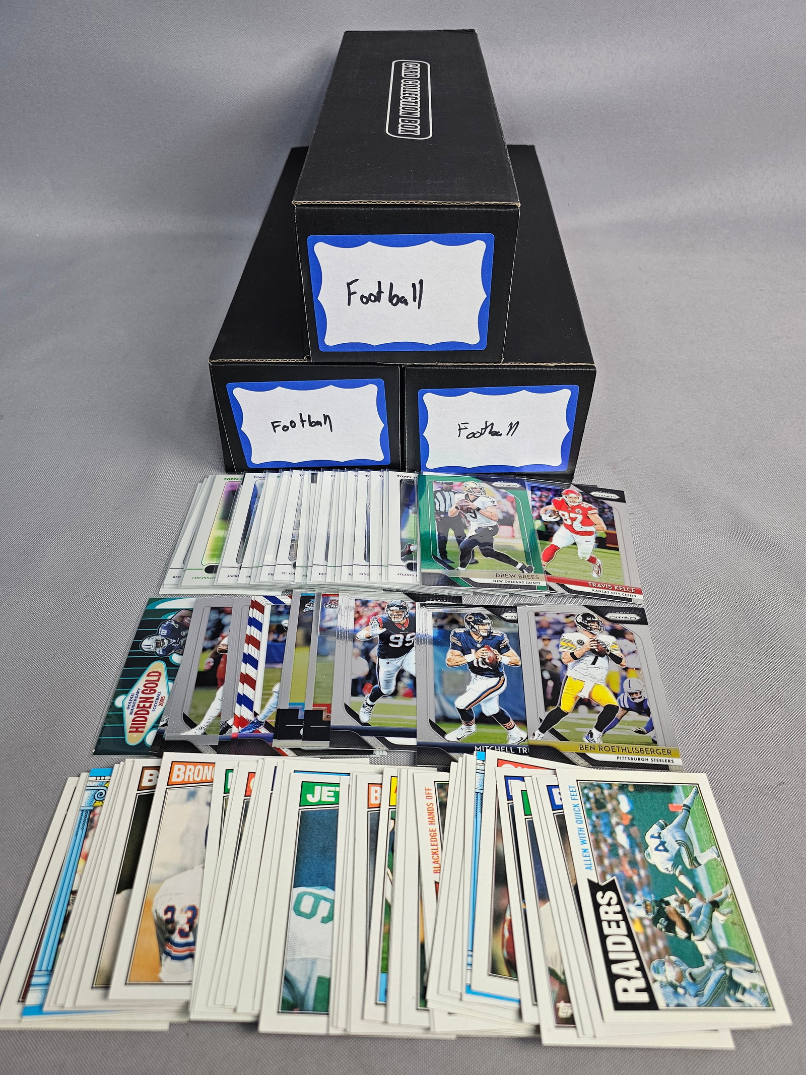 Large Multi-Era NFL Football Collection: This extensive collection of NFL trading cards features various manufacturers including Panini, Topps, and Score. The assortment spans multiple decades, including late 1980s vintage issues and modern