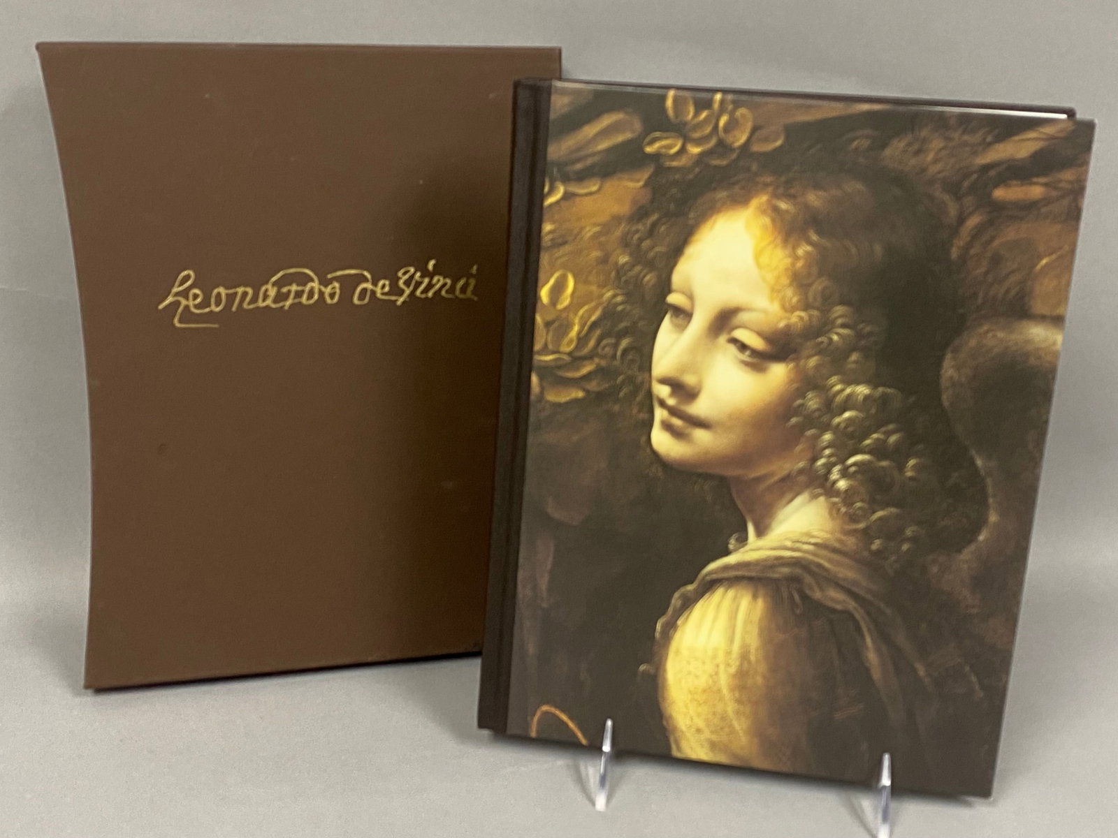 Clark. Leonardo da Vinci. Folio, 2005.: This quarto volume is bound in brown buckram with a printed front board and housed in its original matching slipcase. Published by the Folio Society in 2005, it features a text by Kenneth Clark and an