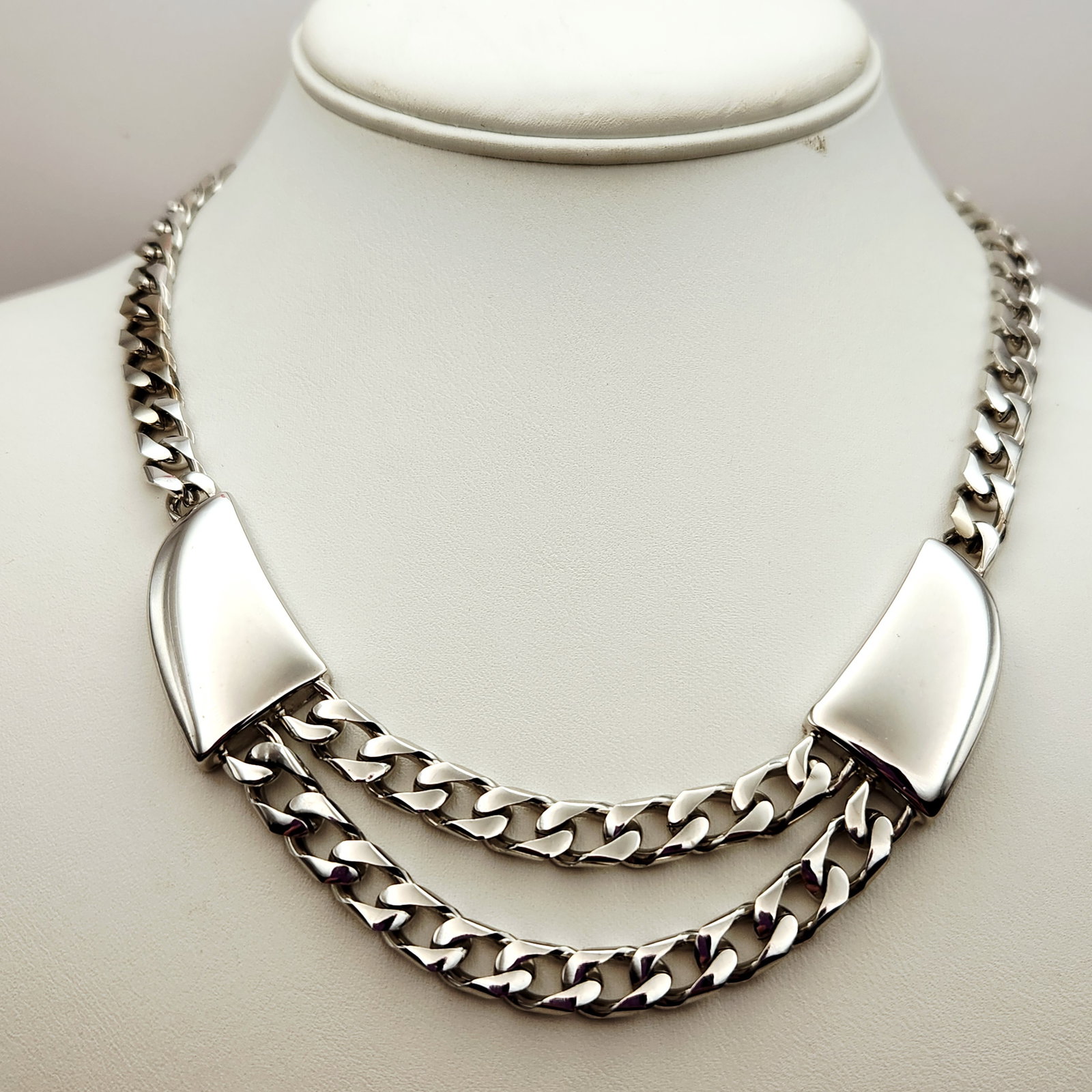 Trifari Modernist Necklace: This silver-toned modernist necklace features a double-strand curb chain accented by two high-polish geometric panels. Total length approximately 17 inches. The necklace is in excellent vintage
