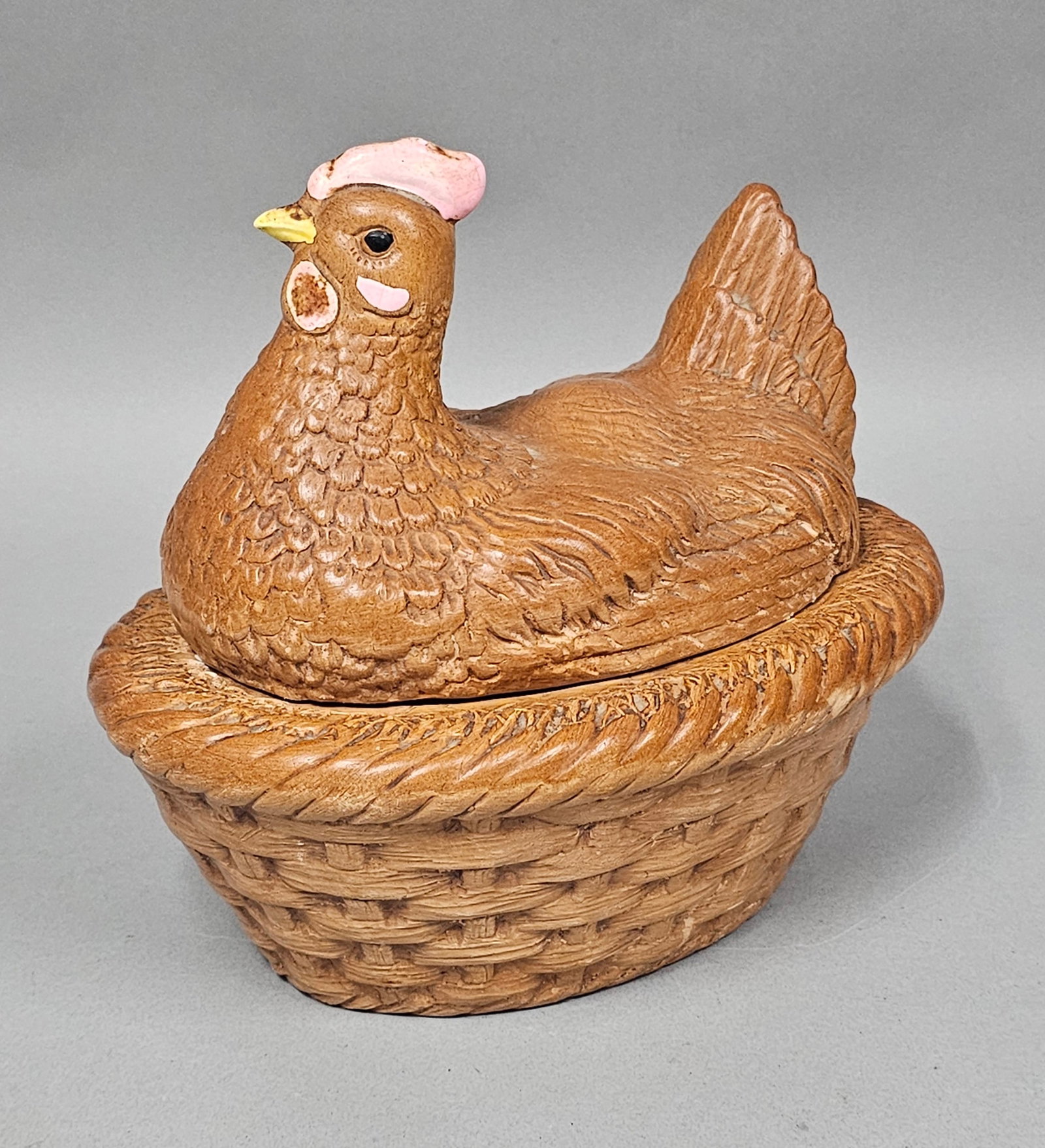 Hirsch Mfg Figural Ceramic Hen on Nest: An American figural lidded dish produced by Hirsch Mfg, modeled as a brooding hen sitting atop a woven nest. The two-piece stoneware set features a lid with molded feathering and a base with a dense