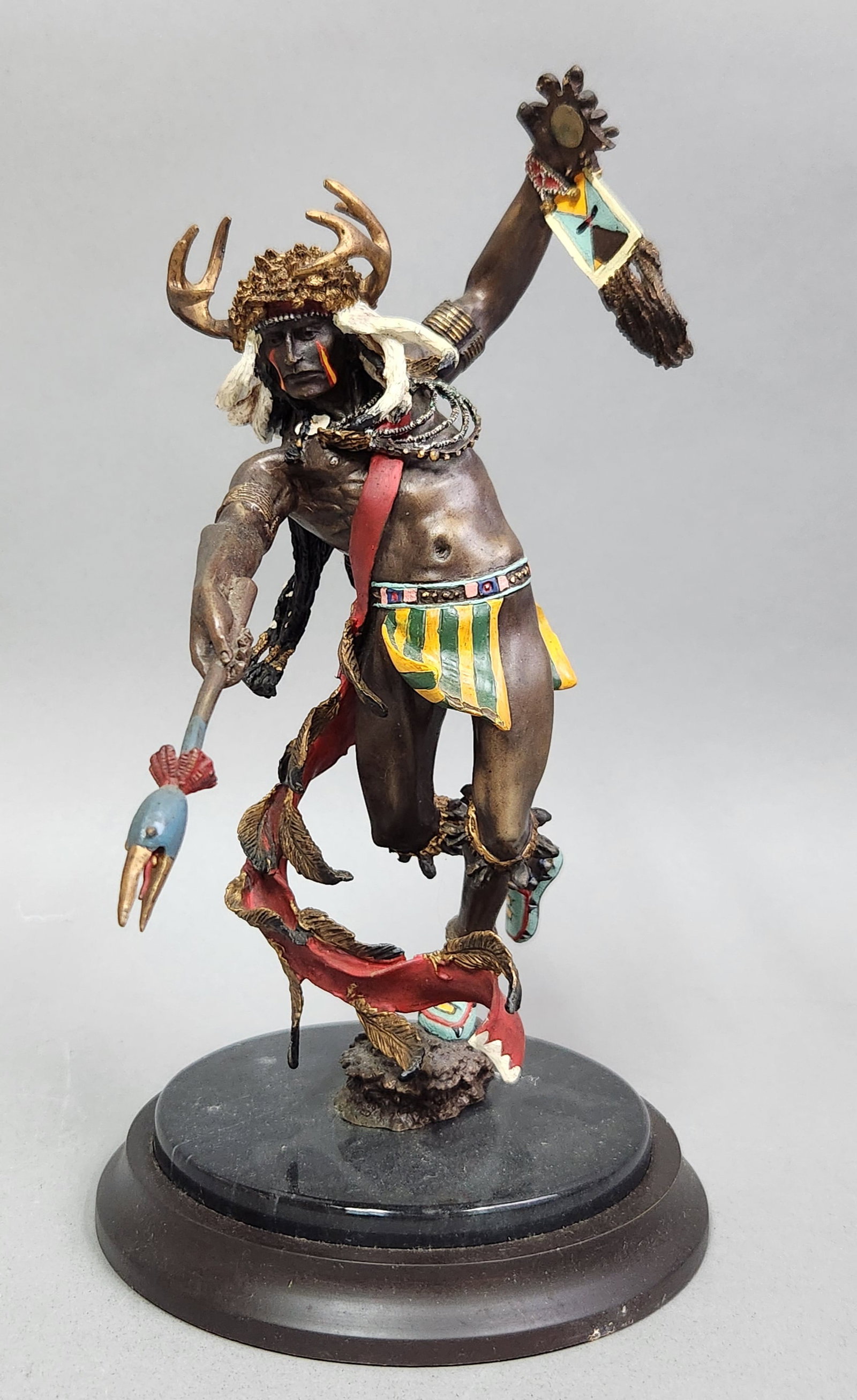 R. J. Murphy Spirit of the Crow Sculpture: This Franklin Mint polychrome sculpture titled Spirit of the Crow is designed by artist R. J. Murphy and depicts a Native American figure in a dynamic ceremonial dance. Height: 11.25 The sculpture is