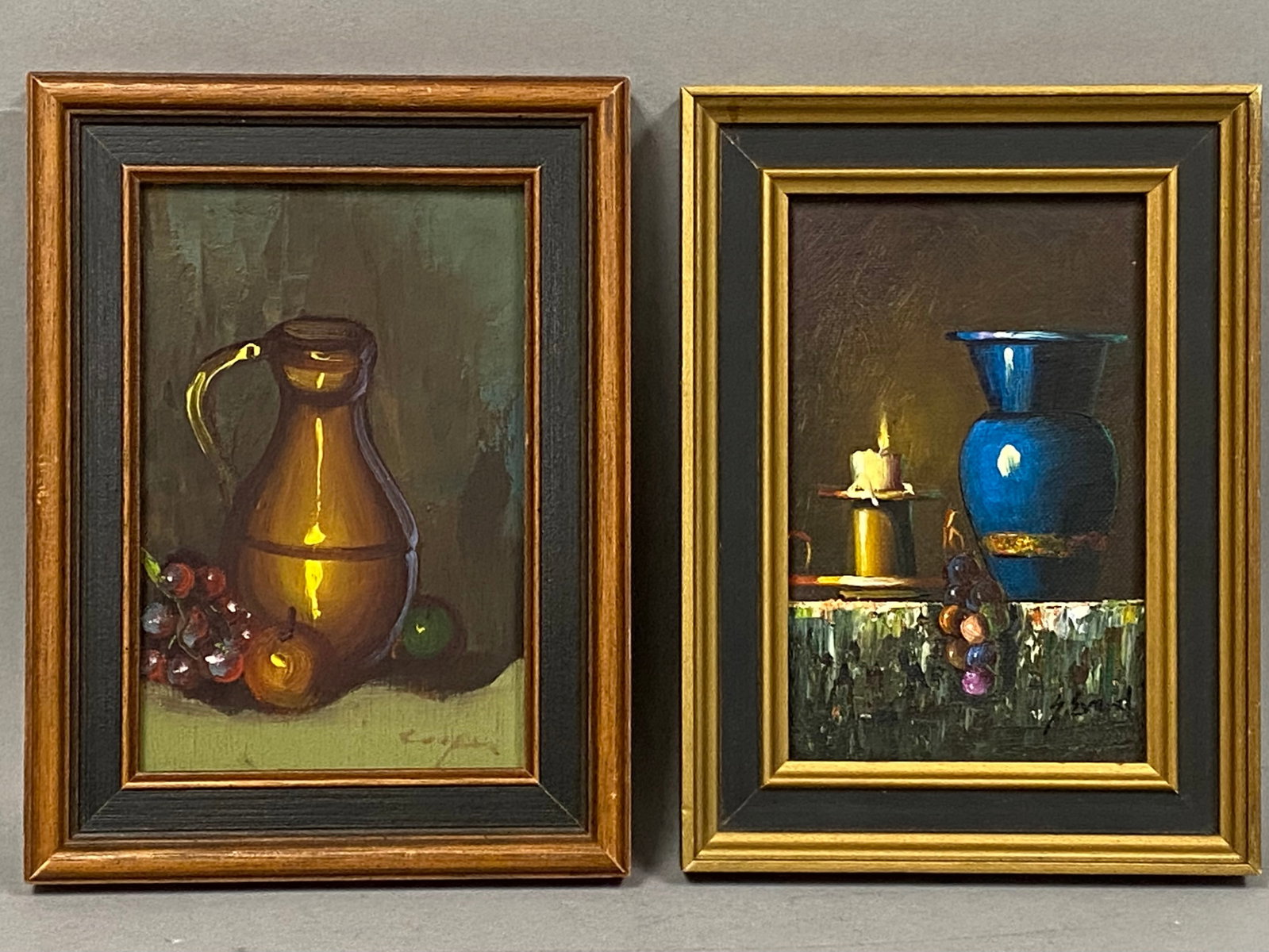 Cooper & J. Bord Oil Still Life Paintings: A pair of 20th-century still life oil paintings on board, each housed in a traditional stepped frame with a black inner cove. The first painting illustrates a copper-toned pitcher accompanied by