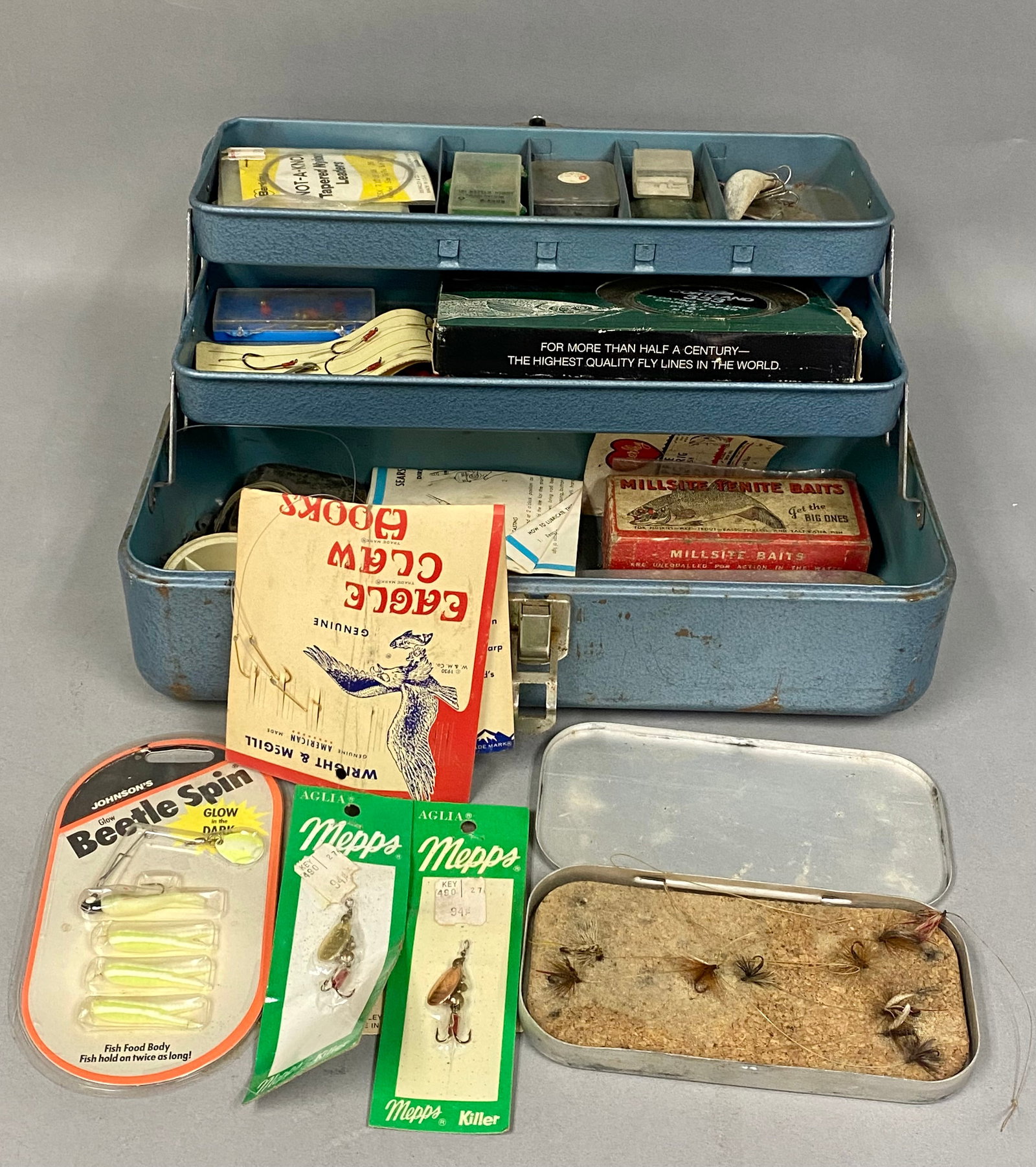 Falls City My Buddy 242 Blue Metal Tackle Box: An assortment of mid-20th-century fishing tackle and gear housed in a blue hammered-finish metal tackle box. The box exterior features an adhesive shield-shaped decal reading My Buddy, SINCE 1862, A F