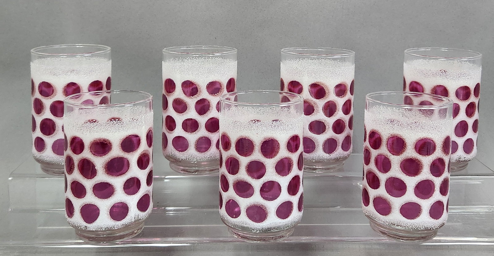 Libbey Concord Cranberry Coin Dot Tumblers #2: A set mid-century modern beverage tumblers produced by the Libbey Glass Company. Height: 4.75 inches The tumblers are in very good vintage condition, with the white textured frosting appearing