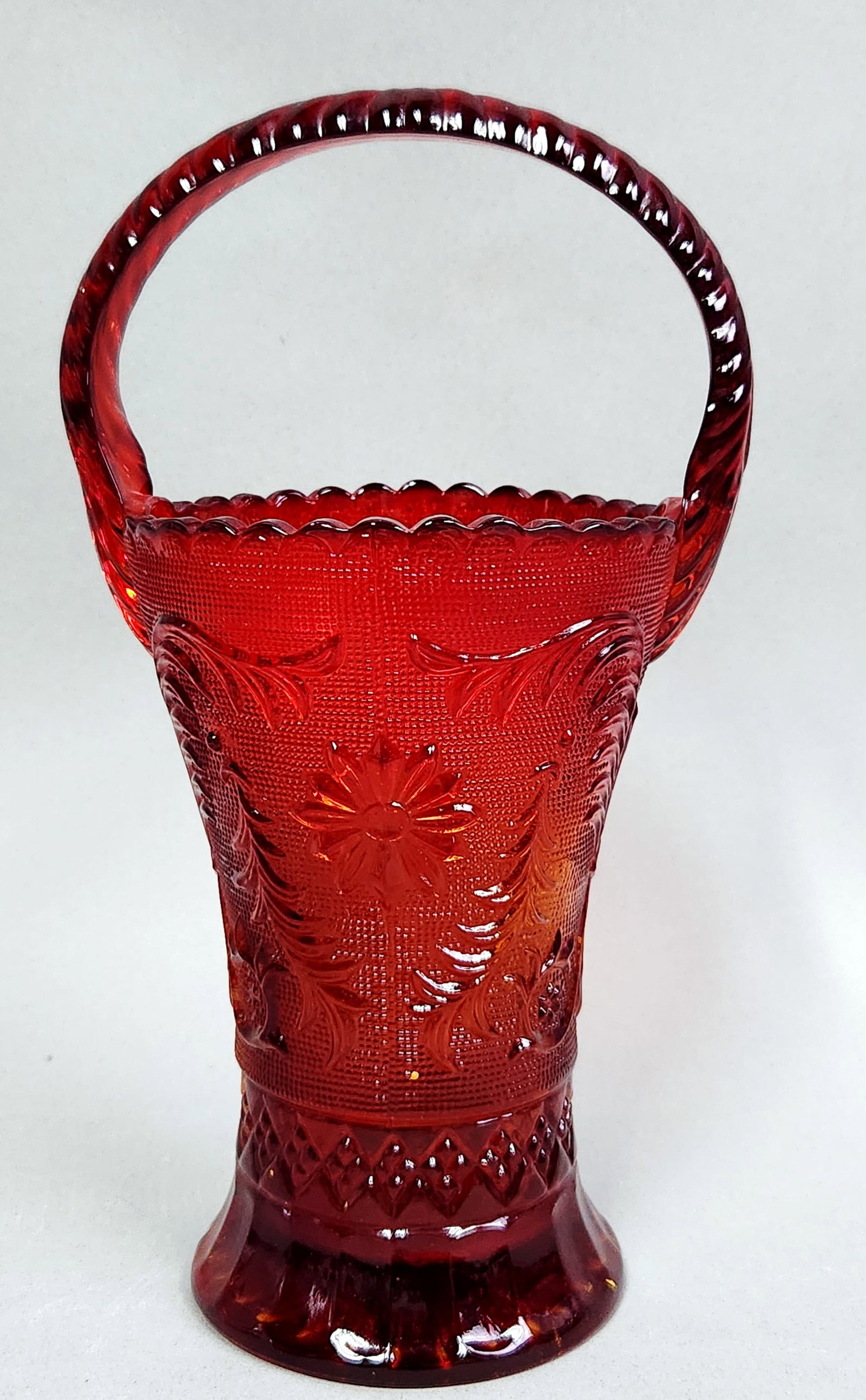 Indiana Glass Tiara Amberina Basket: A Tiara vintage pressed glass basket featuring a heat-sensitive color transition known as amberina. Height: 12 inches The basket is in very good vintage condition with no visible chips, cracks, or