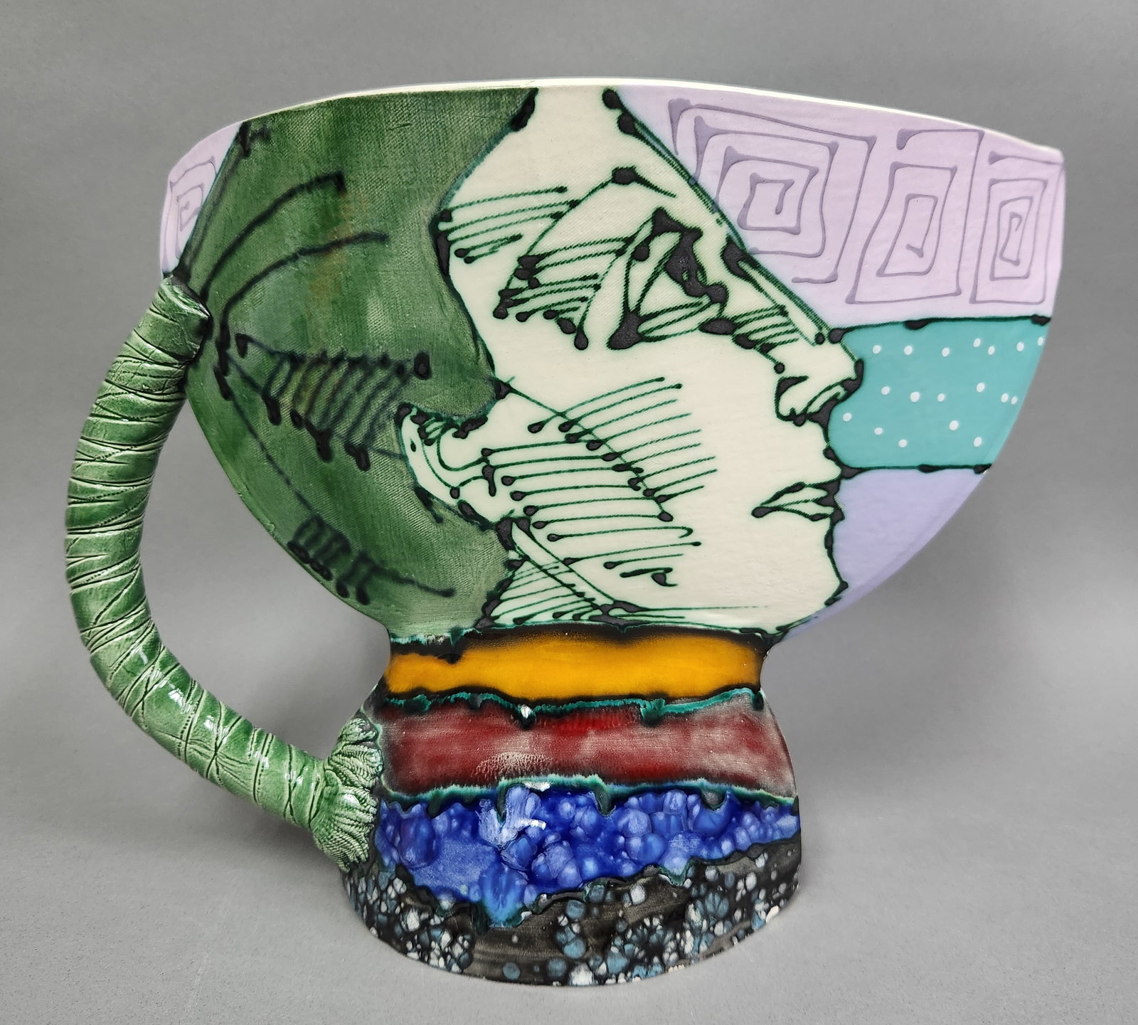 Salvadori Glazed Earthenware Art Vessel: A large hand-painted contemporary earthenware art vessel featuring a modernist Janus-like design. Height: 10 1/4 inches The vessel is in good vintage condition with vibrant glaze colors. One small