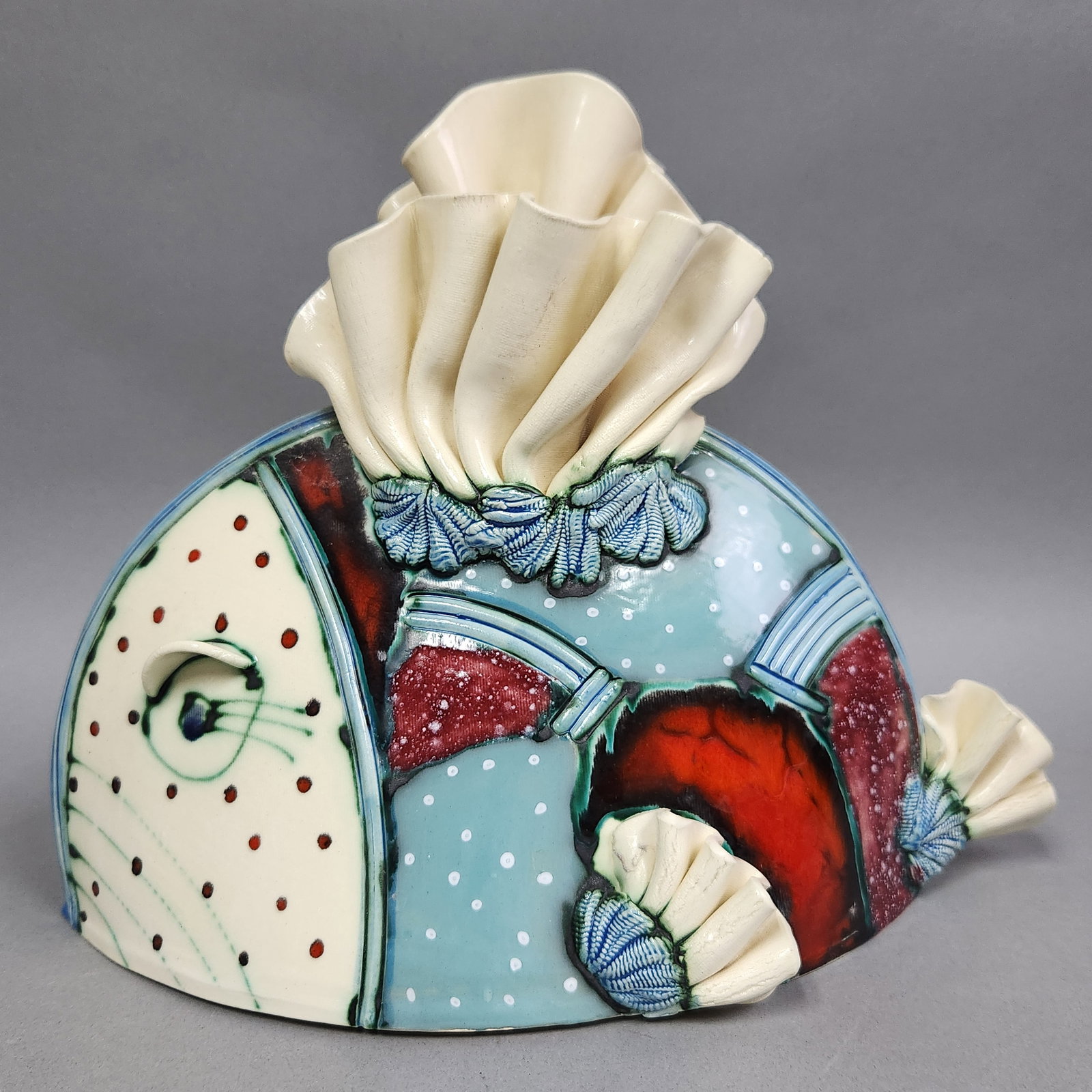 Ceramic Fish Sculpture Signed: A hand-built ceramic sculptural vessel in the form of a fish in the style of Rasa Saldaitis. The piece features slab construction with a flat reverse for mounting. Signature is illegible. Height: 10