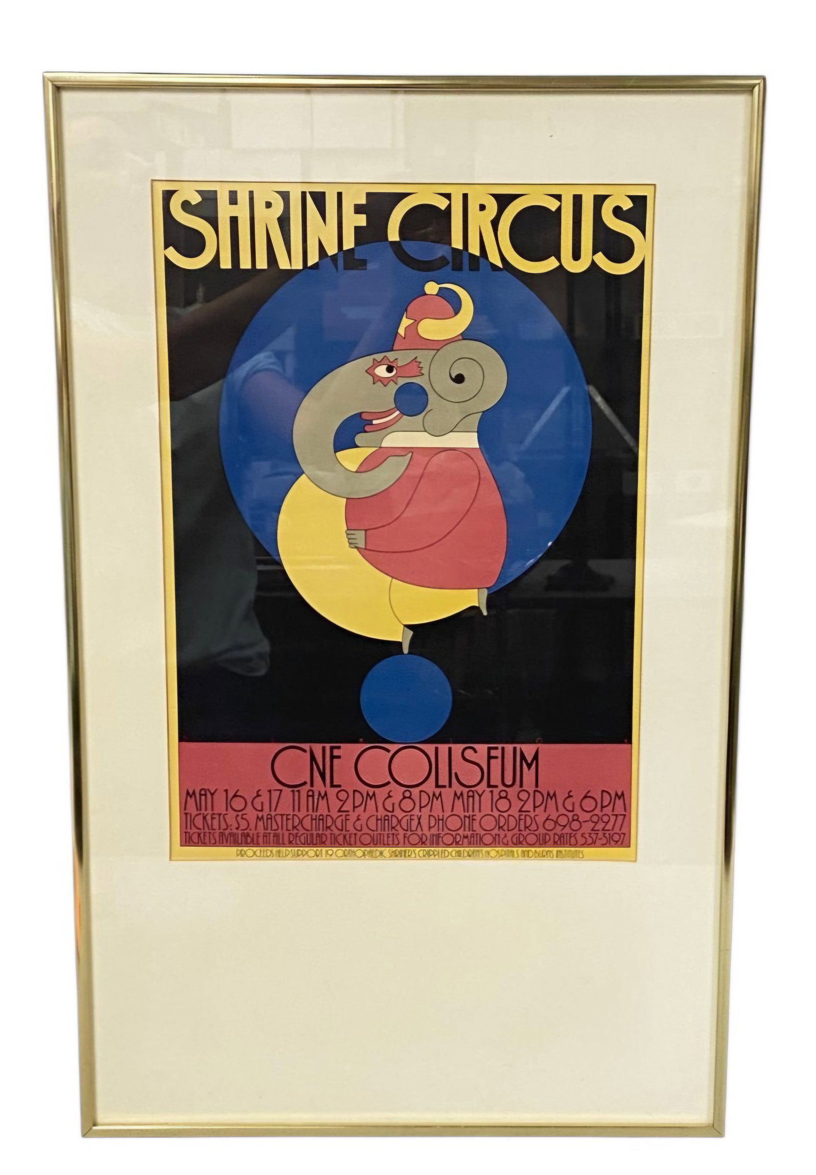 Dimson Shrine Circus CNE Coliseum Framed Poster: A framed vintage advertising poster for the Shrine Circus held at the CNE Coliseum in Toronto. The graphic composition features a stylized, geometric circus elephant dressed in a red jacket and