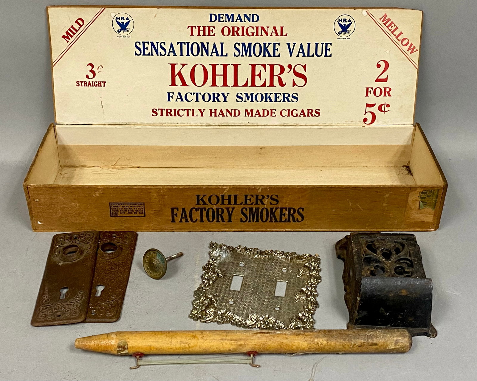 Kohler's Wood Cigar Box & Cast Iron Hardware: An assortment of vintage architectural hardware and tobacco ephemera including a large Kohler's Factory Smokers wooden cigar box. The interior lid is printed with early 1930s National Recovery Adminis
