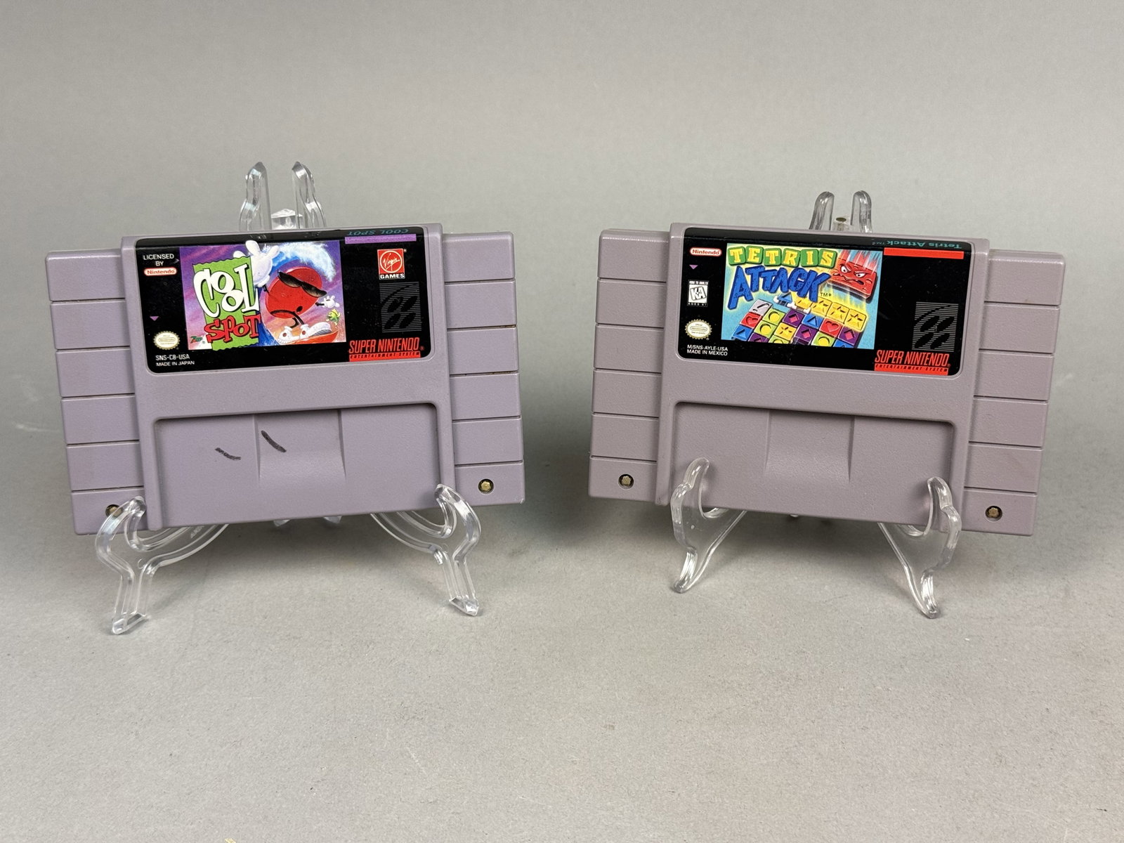 Super Nintendo SNES Tetris Attack & Cool Spot: A lot of two original Super Nintendo Entertainment System (SNES) video game cartridges featuring Tetris Attack by Nintendo and Cool Spot by Virgin Games. Both units include their original factory