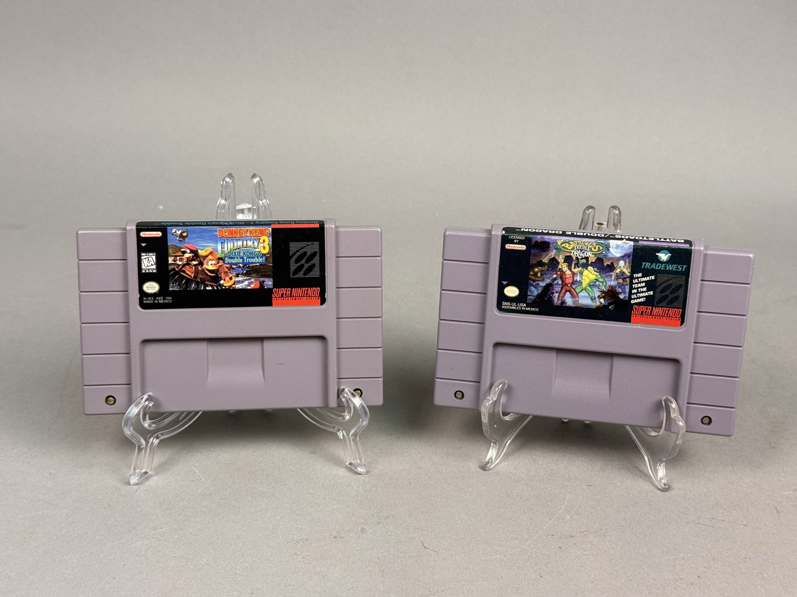 Super Nintendo Donkey Kong 3 & Battletoads Double Dragon: Super Nintendo Entertainment System cartridges include Donkey Kong Country 3: Dixie Kong's Double Trouble! and Battletoads / Double Dragon: The Ultimate Team. Both games have been tested to confirm