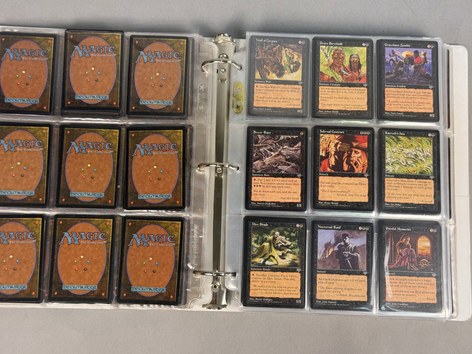 Magic The Gathering Mirage Card Collection: A collection of Magic: The Gathering trading cards from the 1996 Mirage expansion set, housed in a white three-ring binder with Ultra PRO pages. The assortment includes black-border cards such as
