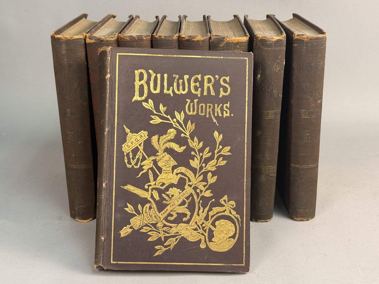 Bulwer Lytton Bulwer's Works Collier Set: A multi-volume set of The Works of Edward Bulwer Lytton published in New York by P. F. Collier. The volumes are bound in uniform brown publisher's cloth featuring elaborate gilt-stamped neoclassical
