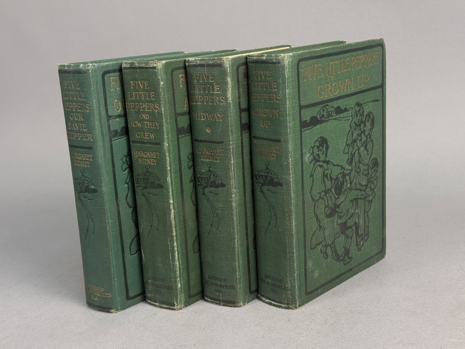 Sidney. Five Little Peppers Collection.: A collection of volumes from the Five Little Peppers series by Margaret Sidney, published by Lothrop, Lee & Shepard Co. The octavo volumes are bound in uniform green cloth featuring black-stamped