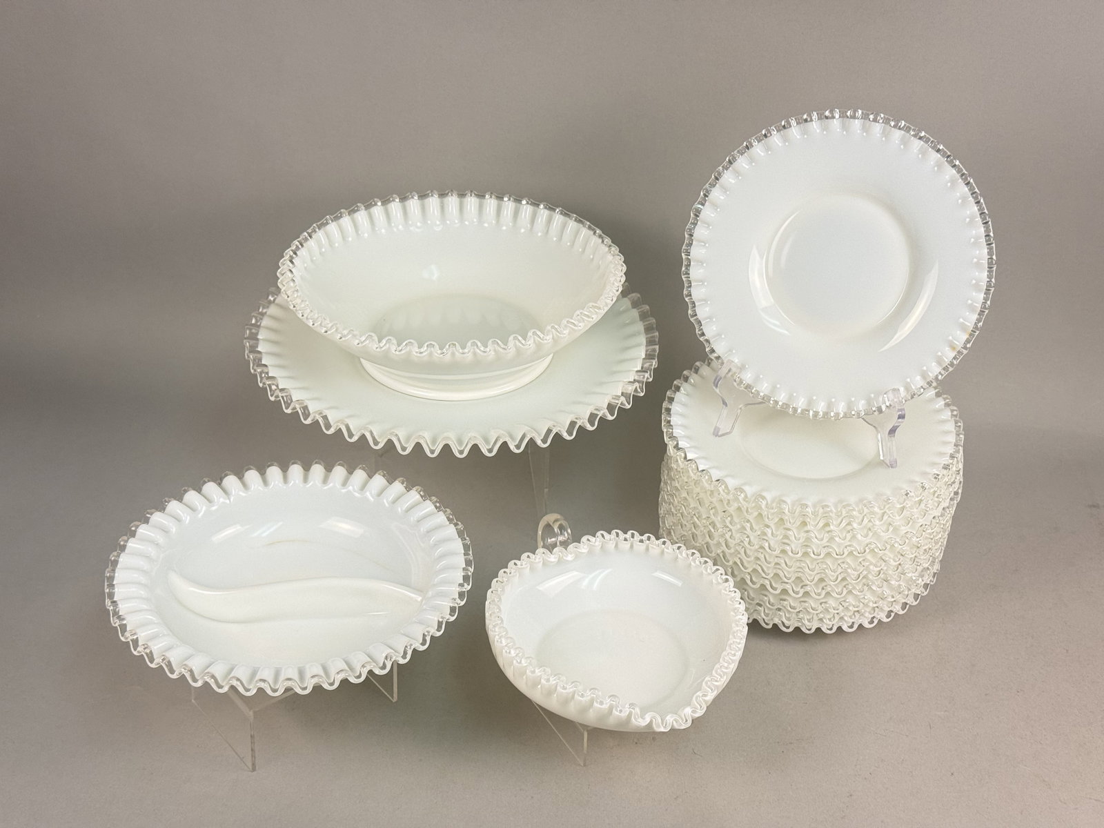 Fenton Silver Crest Milk Glass Collection: This extensive group of Fenton Silver Crest milk glass features an opaque white body with clear crimped crystal edges. The set consists of a large bowl, platter, divided dish, heart-shaped nappy, and 