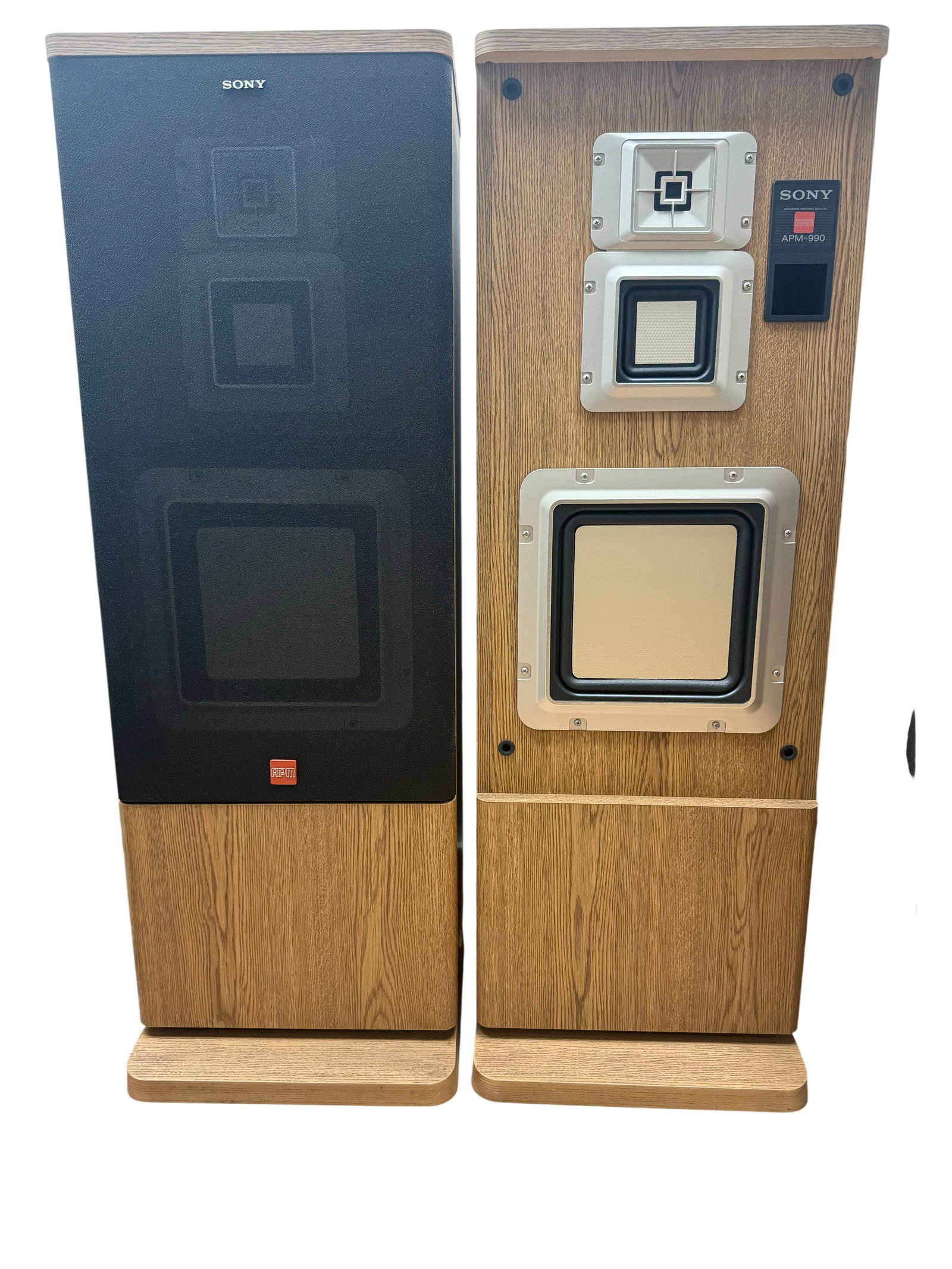 Sony APM-990 Wood Grain Floor Speakers: A pair of Sony APM-990 floor-standing loudspeakers featuring Accurate Pistonic Motion technology. These speakers utilize square diaphragms in a three-way configuration, including a square tweeter, a