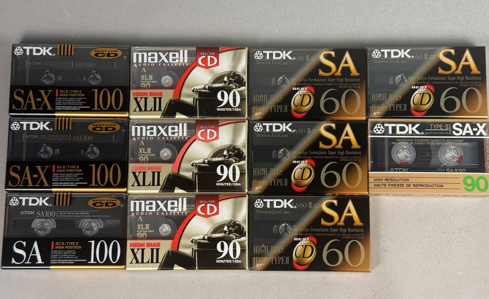 10 TDK & Maxell Type II Blank Audio Cassettes: An assortment of ten vintage blank audio cassette tapes, all featuring Type II High Bias formulations. The lot includes two TDK SA-X 100 Super Avilyn Extra units with the Super Precision