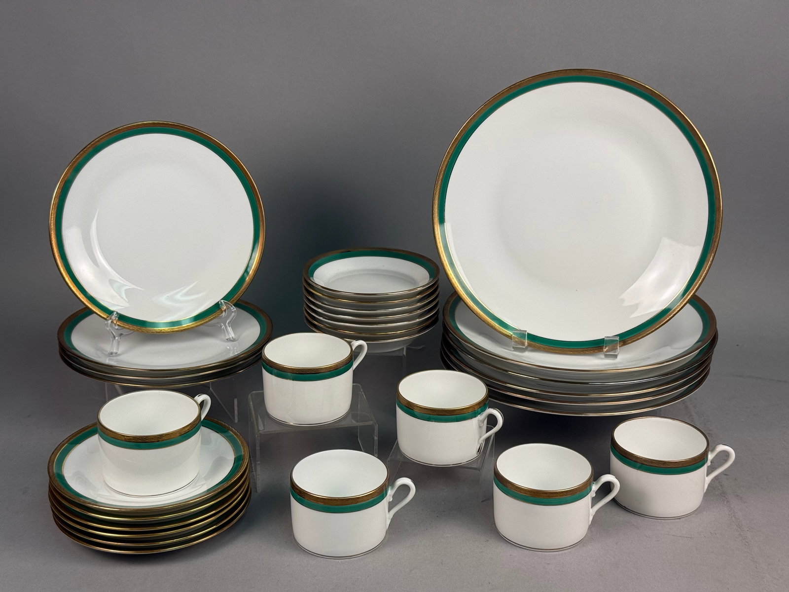 Richard Ginori Palermo Green Porcelain Dinner Service: A partial porcelain dinner service in the Palermo Green pattern by Richard Ginori. This Italian-made service is characterized by a crisp white ground decorated with a broad emerald green band at the