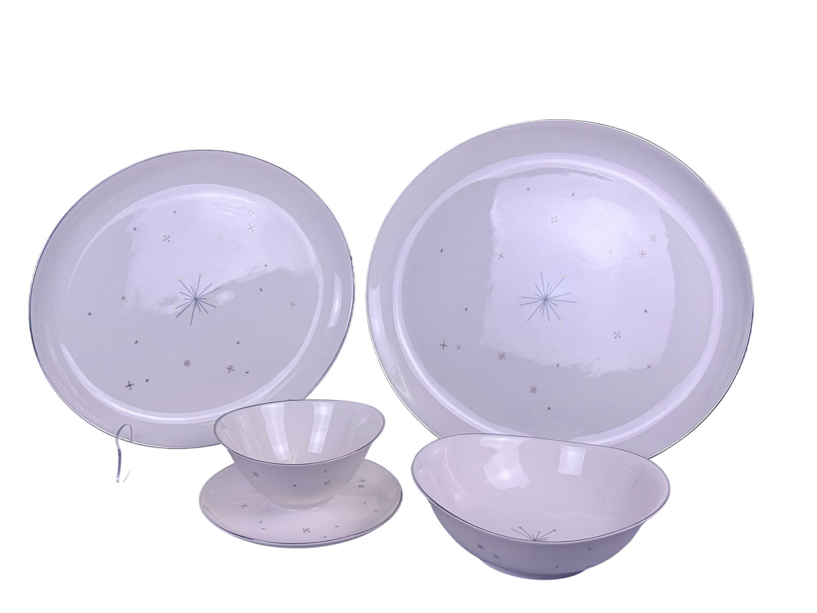 Syracuse Evening Star Porcelain Serving Set: A set of vitrified porcelain serving pieces manufactured by Syracuse China in the Evening Star pattern. The design features a Mid-Century Modern Atomic motif, centered by a black-line starburst with