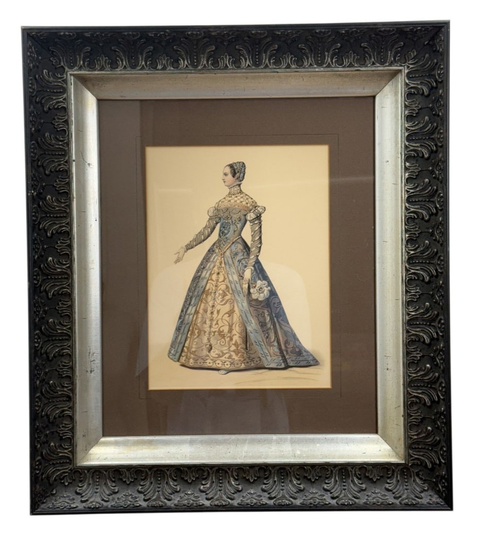 Framed Renaissance Costume Plate Print: This framed decorative print depicts a noblewoman in a Renaissance-style costume plate presented in profile. The figure wears an elaborate gown with a lace-trimmed ruff collar and holds a stylized fea