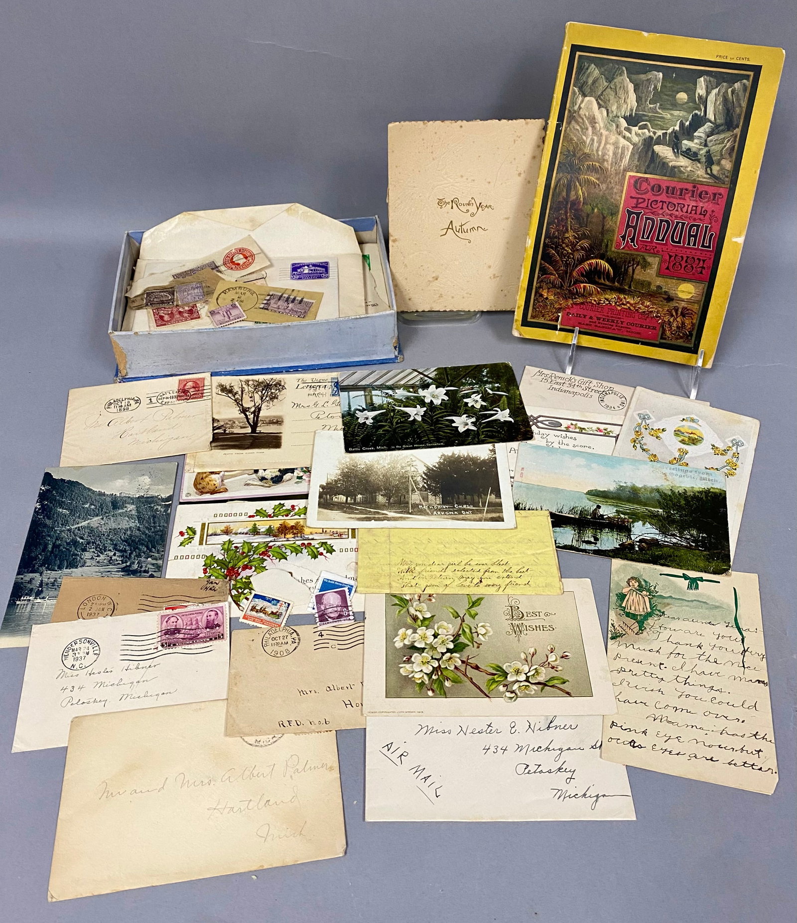 Collection of Michigan Family Ephemera: This collection of paper ephemera centers on the Palmer and Hibner families of Michigan and includes a Courier Pictorial Annual for 1884 published in East Saginaw. The lot features an early