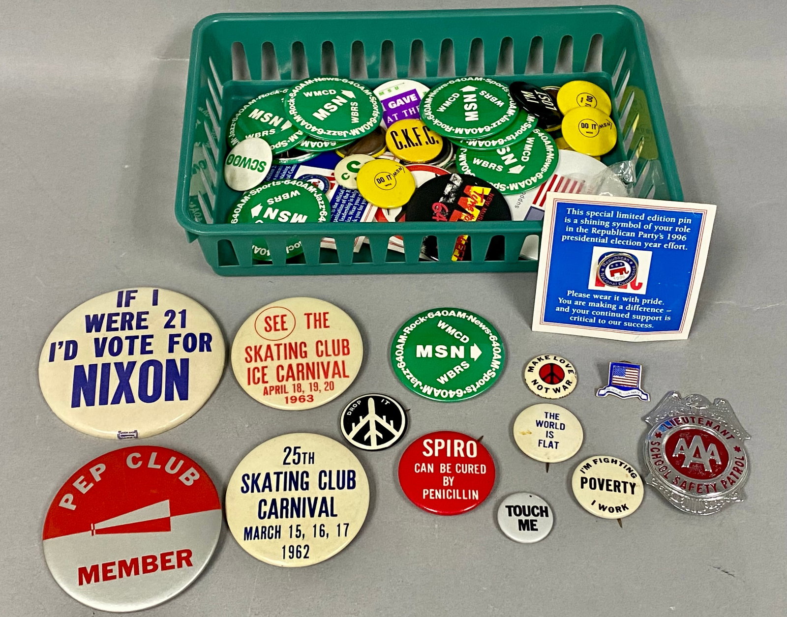 Vintage Political and Promotional Pinback Lot: This collection includes an assortment of celluloid and metal pinback buttons, enameled lapel pins, and a stamped metal badge dating from the 1960s to the 1990s. Notable political items include a 1960