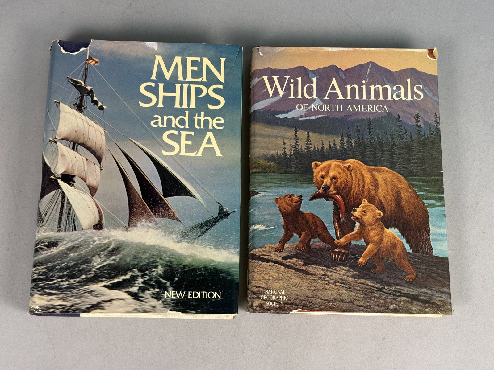 National Geographic Society Vintage Hardcover Books: A pair of vintage hardcover reference books published by the National Geographic Society. The first volume is Men, Ships, and the Sea, featuring contributions by Captain Alan Villiers and others,