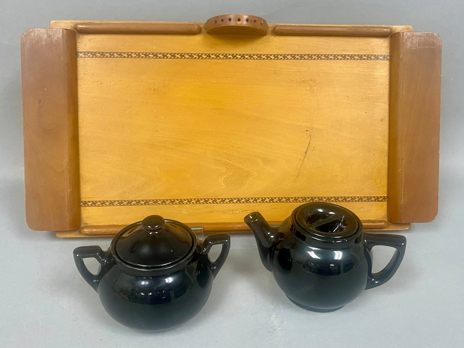 Lipton's Tea Advertising Sugar and Service Items: The lidded sugar bowl features an impressed mark on the base reading LIPTON'S TEA, while the teapot base is impressed MADE IN U.S.A. The rectangular tray is decorated with chevron-patterned wood