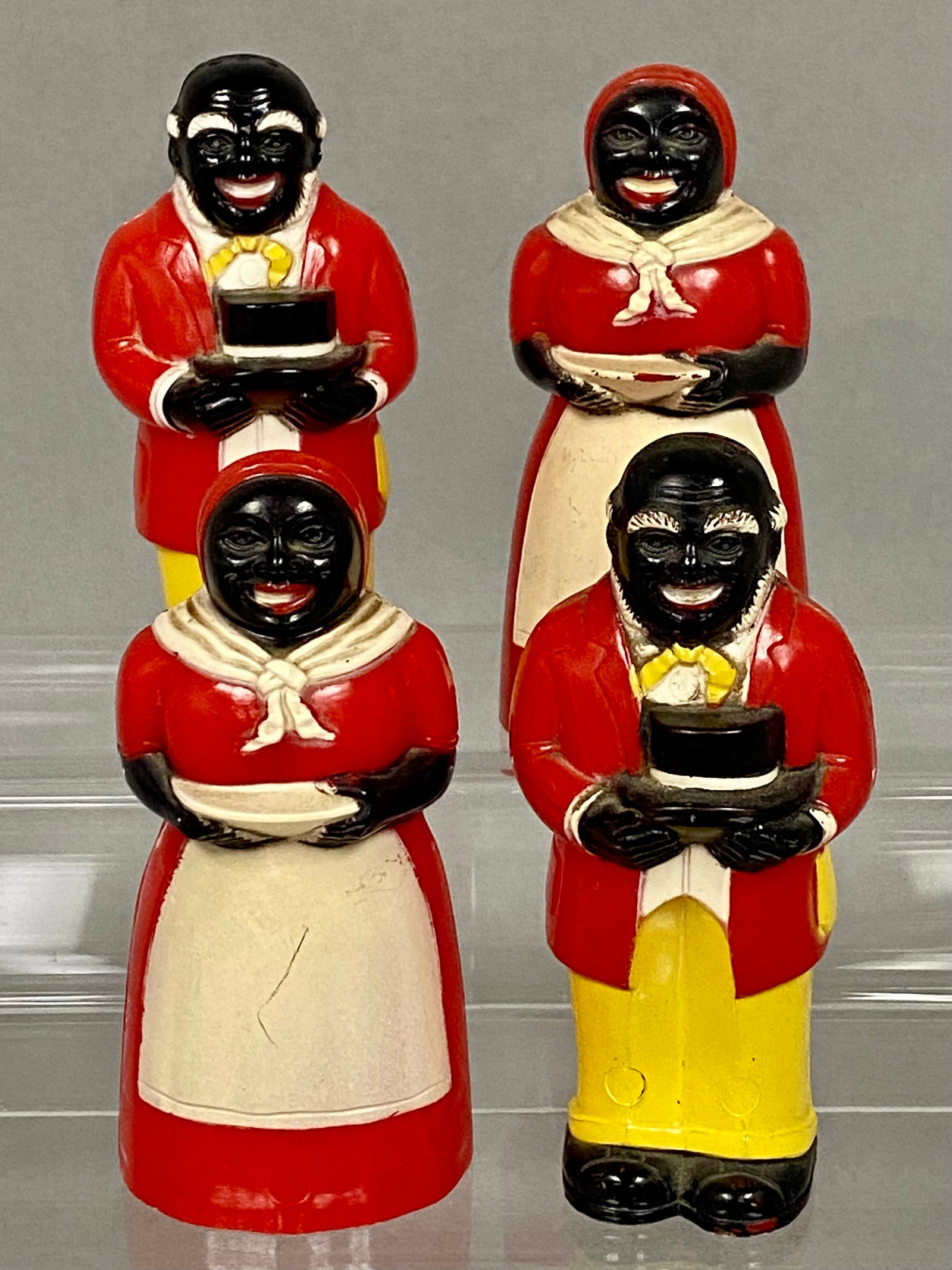 F. & F. Aunt Jemima & Uncle Mose Plastic Shakers: A collection of four vintage plastic salt and pepper shakers depicting the promotional characters Aunt Jemima and Uncle Mose. These figures were manufactured by F. & F. Mold & Die Works in Dayton, Ohi