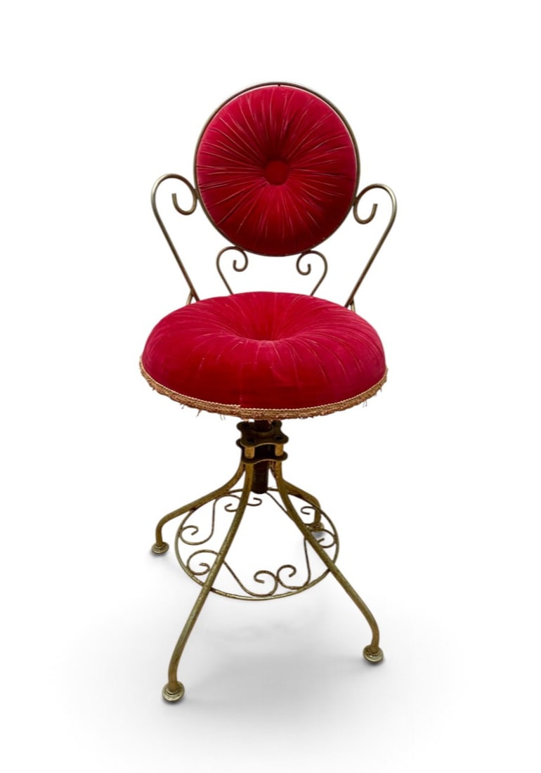 Delta Metal Industries Gilt Metal Swivel Vanity Chair: A vintage mid-century swivel vanity chair distributed by Delta Metal Industries of Brooklyn, New York. The piece features a Hollywood Regency aesthetic with a gilt-finished metal frame constructed