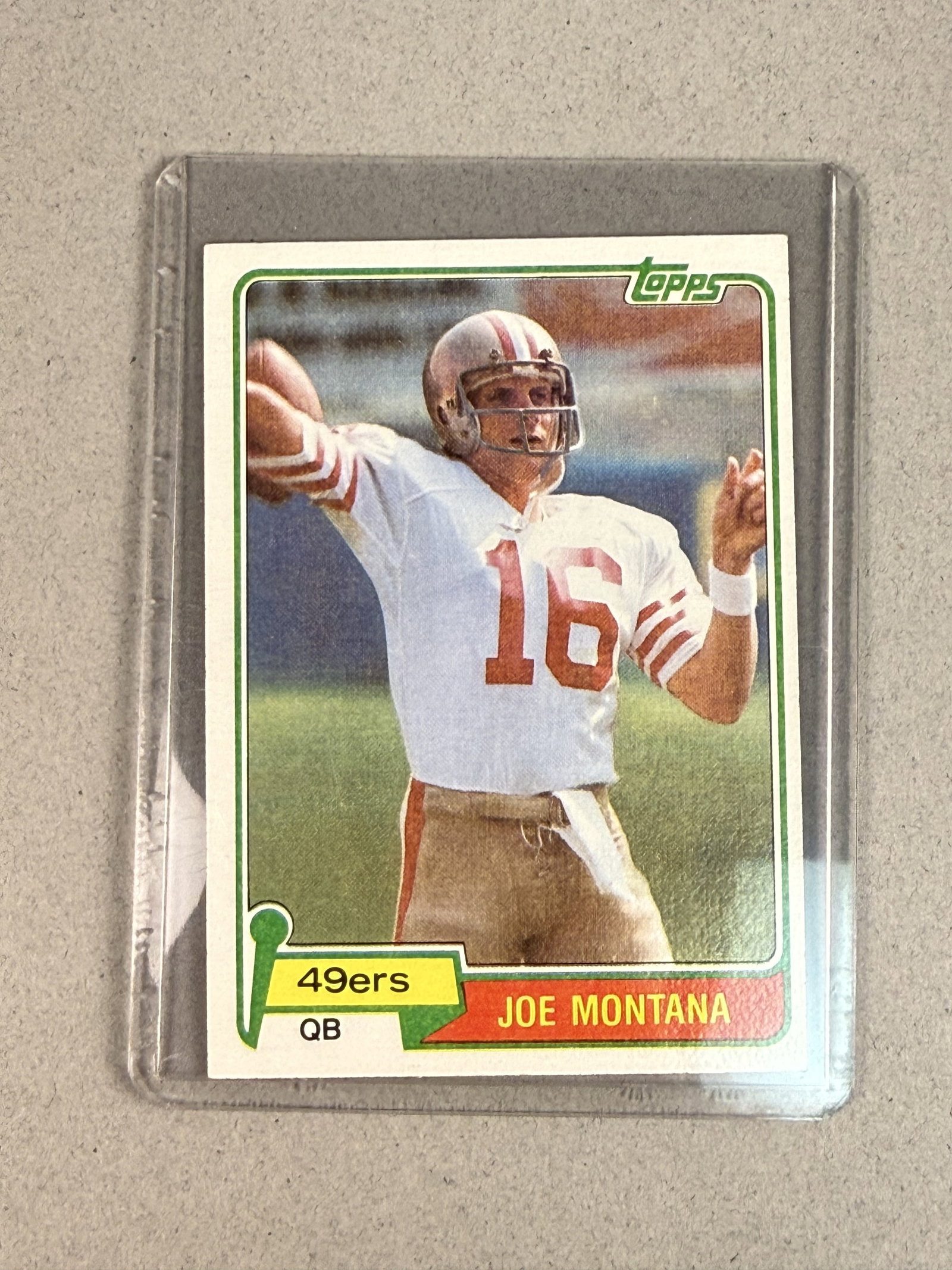 1981 Topps Joe Montana Rookie Card: A 1981 Topps football trading card featuring Hall of Fame quarterback Joe Montana in his rookie year for the San Francisco 49ers. The card displays a color action photograph of Montana in his white te