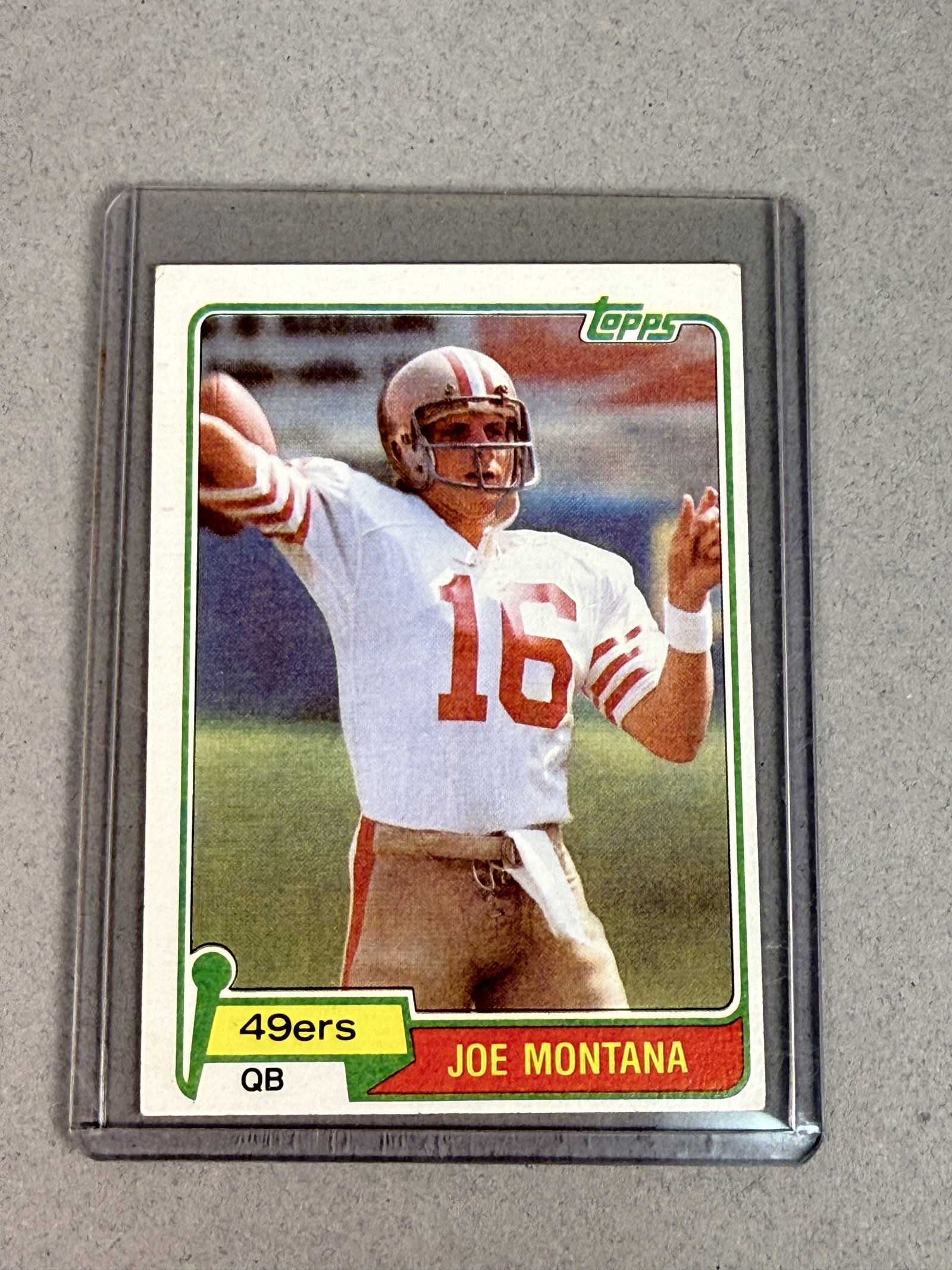 1981 Topps Joe Montana Rookie Card: An authentic 1981 Topps football trading card featuring San Francisco 49ers quarterback Joe Montana, identified as card number 216 and his primary rookie issue. The card front displays a color photogr