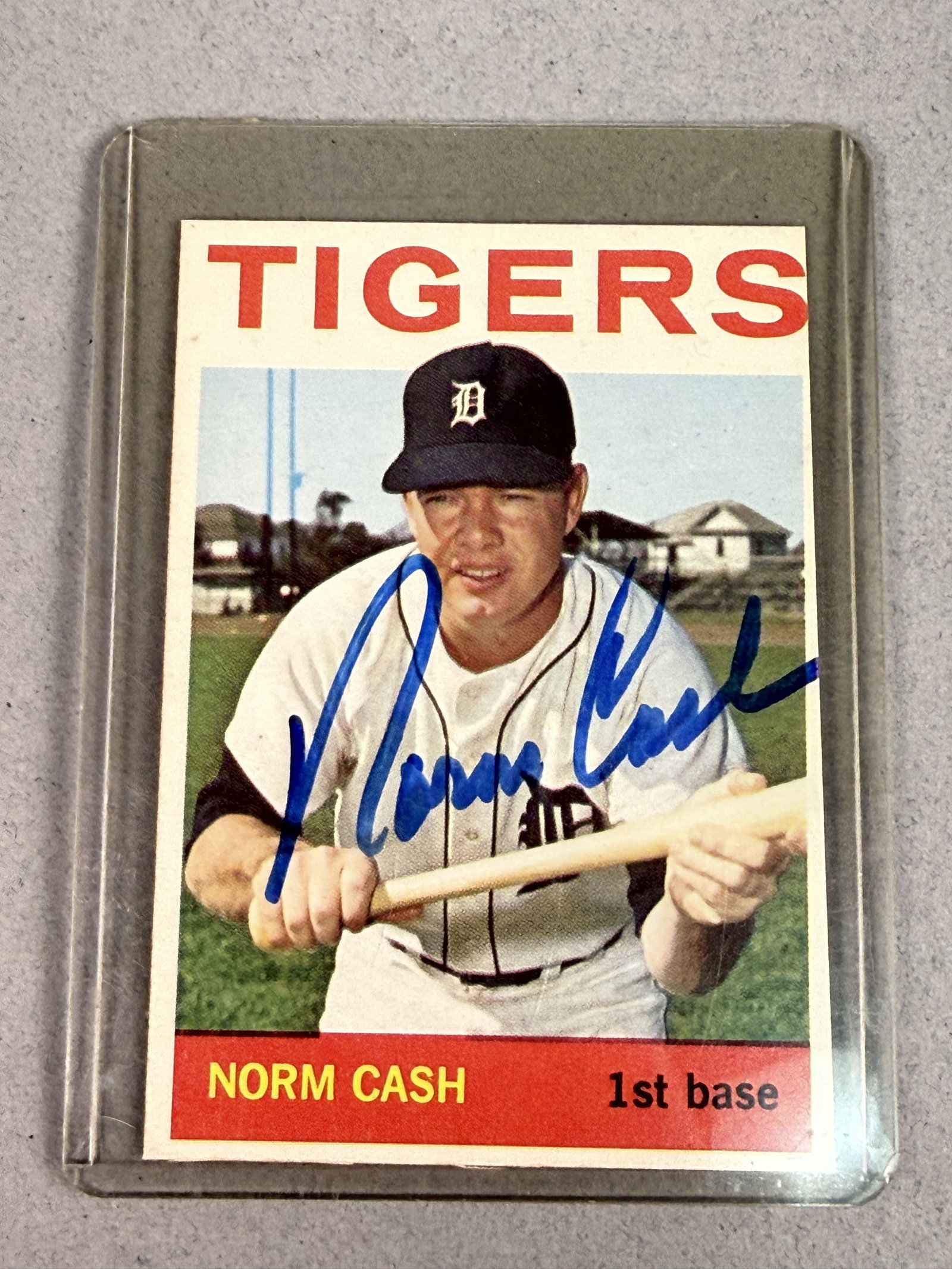 1964 Topps Signed Norm Cash Baseball Card: A vintage 1964 Topps baseball trading card, number 425, featuring 1st baseman Norm Cash of the Detroit Tigers. A cursive signature in blue marker reading Norm Cash is written across the center of the 